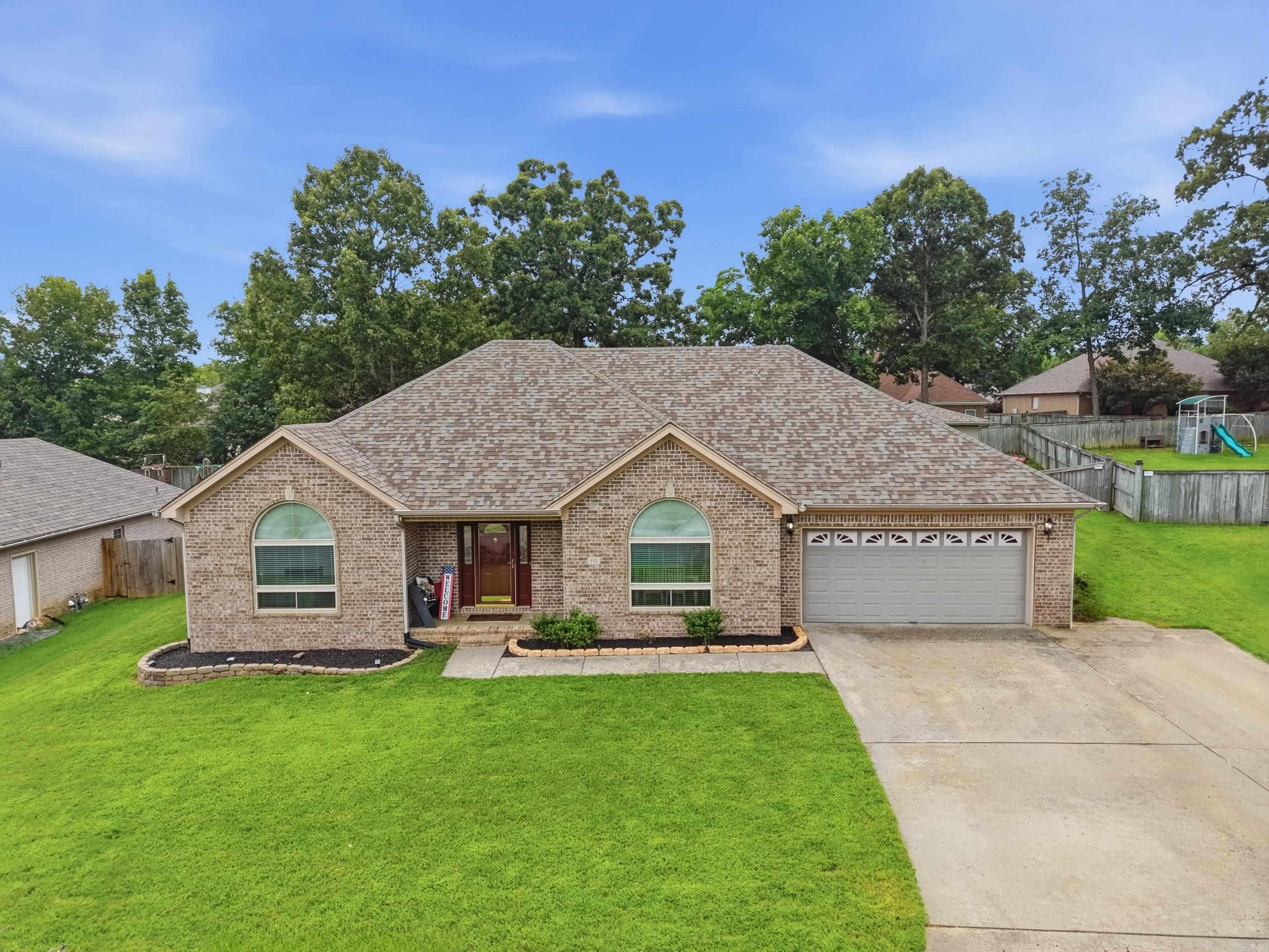 This home has tons of extras! Enjoy the powered shop in the backyard with insulation, a window unit, and garage door. The extra wide driveway allows for extra parking and a walk path to the side entry and backyard. The home has a great layout with a split floor plan and the bonus fourth bedroom and third bathroom upstairs. There is new lighting in the main living space, which looks fantastic with the quartz counters and stainless appliances, which all convey. The washer and dryer stay as well and the hot tub in the backyard is a possibility. The Sellers are even offering a one year home warranty.