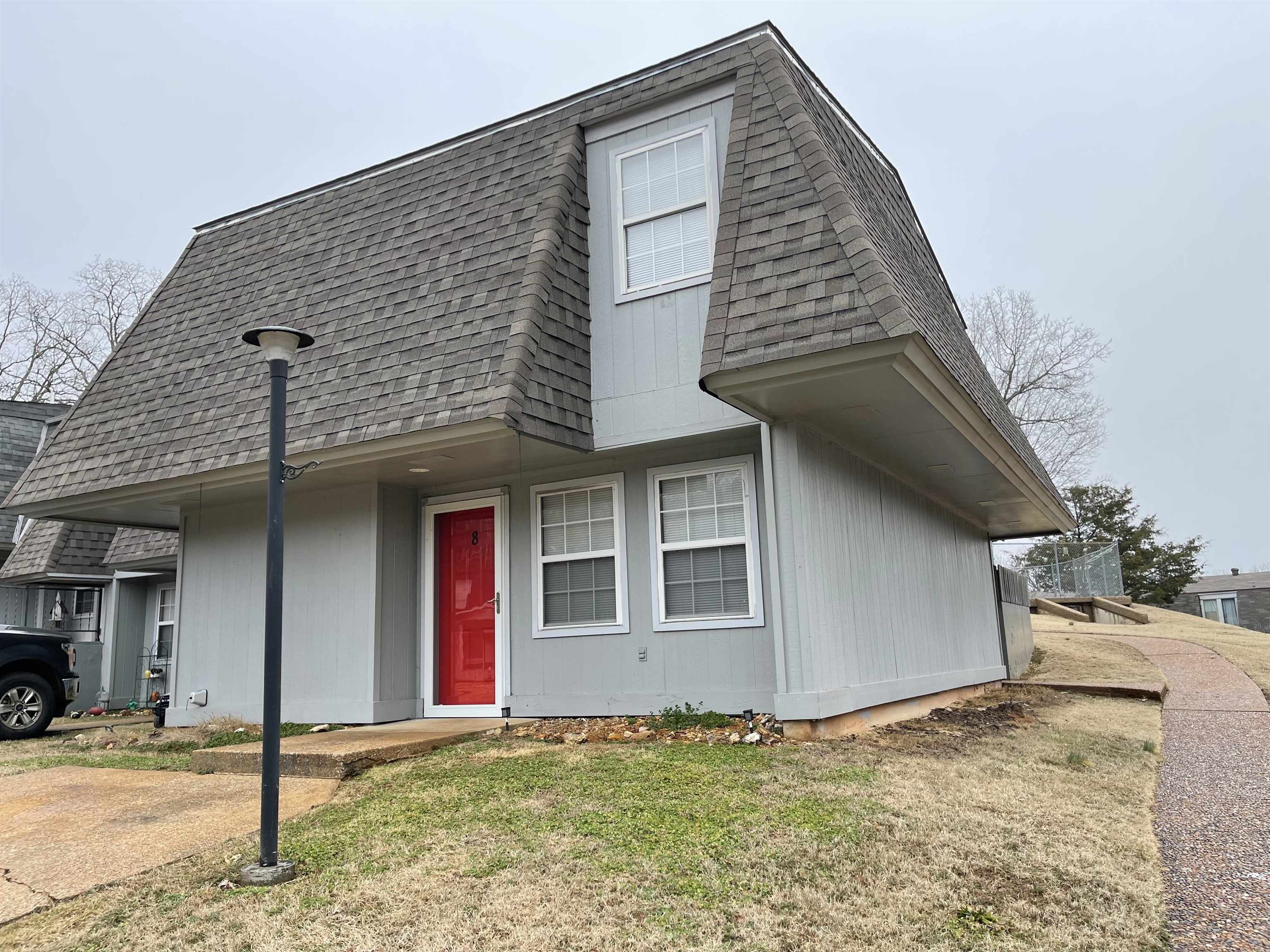 Charming 2-level end-unit townhome in Cherokee Village—move-in ready and ideal for full-time living, a vacation getaway, or investment property! Walking distance to Lake Thunderbird and the scenic Spring River.  Enjoy peace of mind with major upgrades in 2023, including a new heat pump, roof, windows, storm doors, and water heater. Inside, beautiful cedar wood throughout creates a warm, cabin-style feel with modern updates. Relax by the electric fireplace on cool evenings.  This end-unit offers extra privacy with only one shared wall, plus more natural light from additional windows. Step outside to your private patio—perfect for morning coffee or evening relaxation.  Community amenities include outdoor and year-round heated pools, 7 lakes, 2 championship golf courses, walking trails, and parks. Whether you're looking to unwind or explore, this vibrant community has it all. Excellent potential for VRBO or short-term rental income!