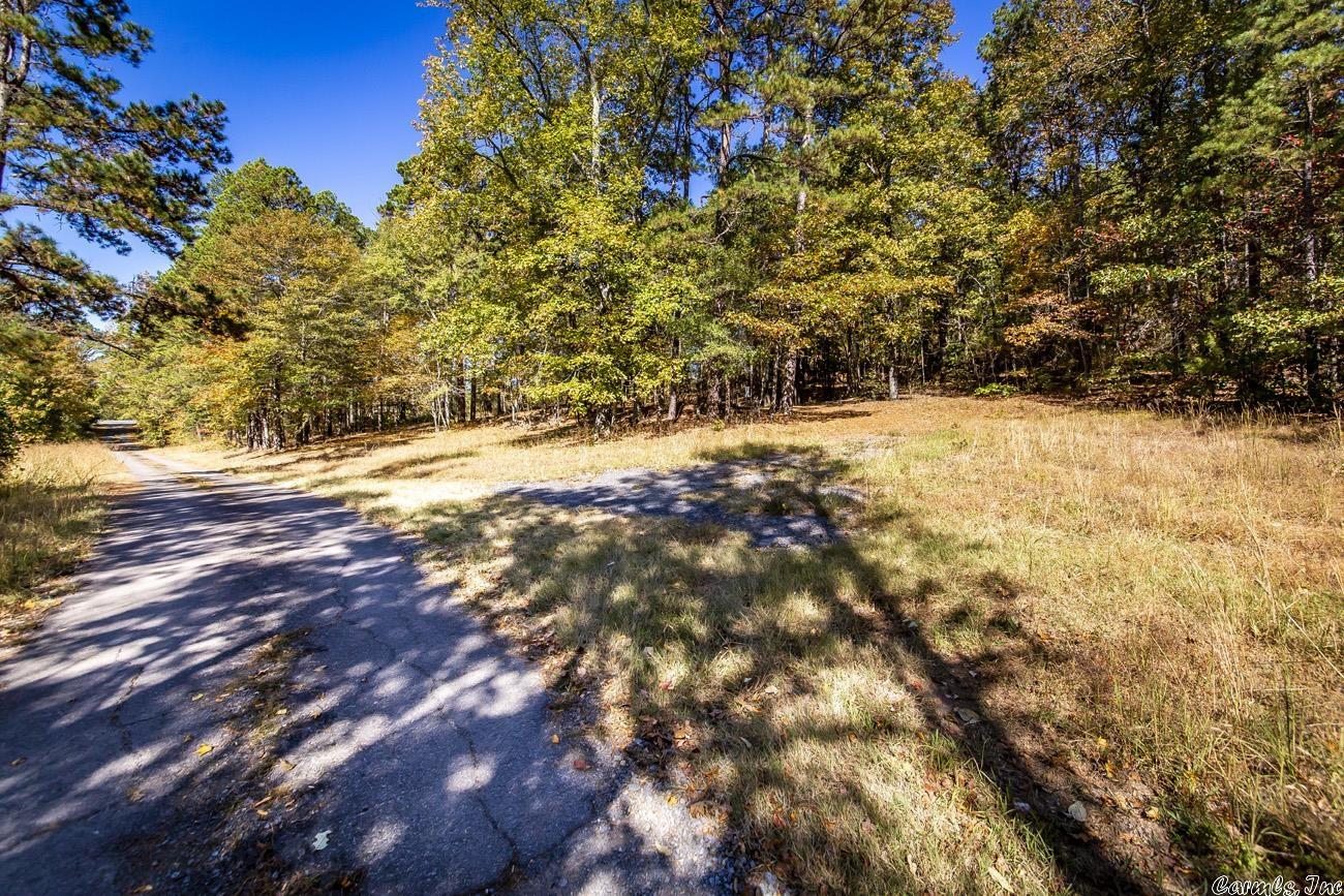 This is a 0.9 acre property that has a 200 amp electric meter setup for a camper or a home, city water is hooked up w/ a meter, septic system, & Highway frontage on AR 9 N & Hackett Lane. There is a level spot on the property where you can put a camper, a mobile home, or you can build. You are 1 minute away from the Middle Fork Little Red River where you can fish, kayak, & swim. Fairfield Bay & Greers Ferry Lake are 10 minutes away. Call for more information & to set up a showing.