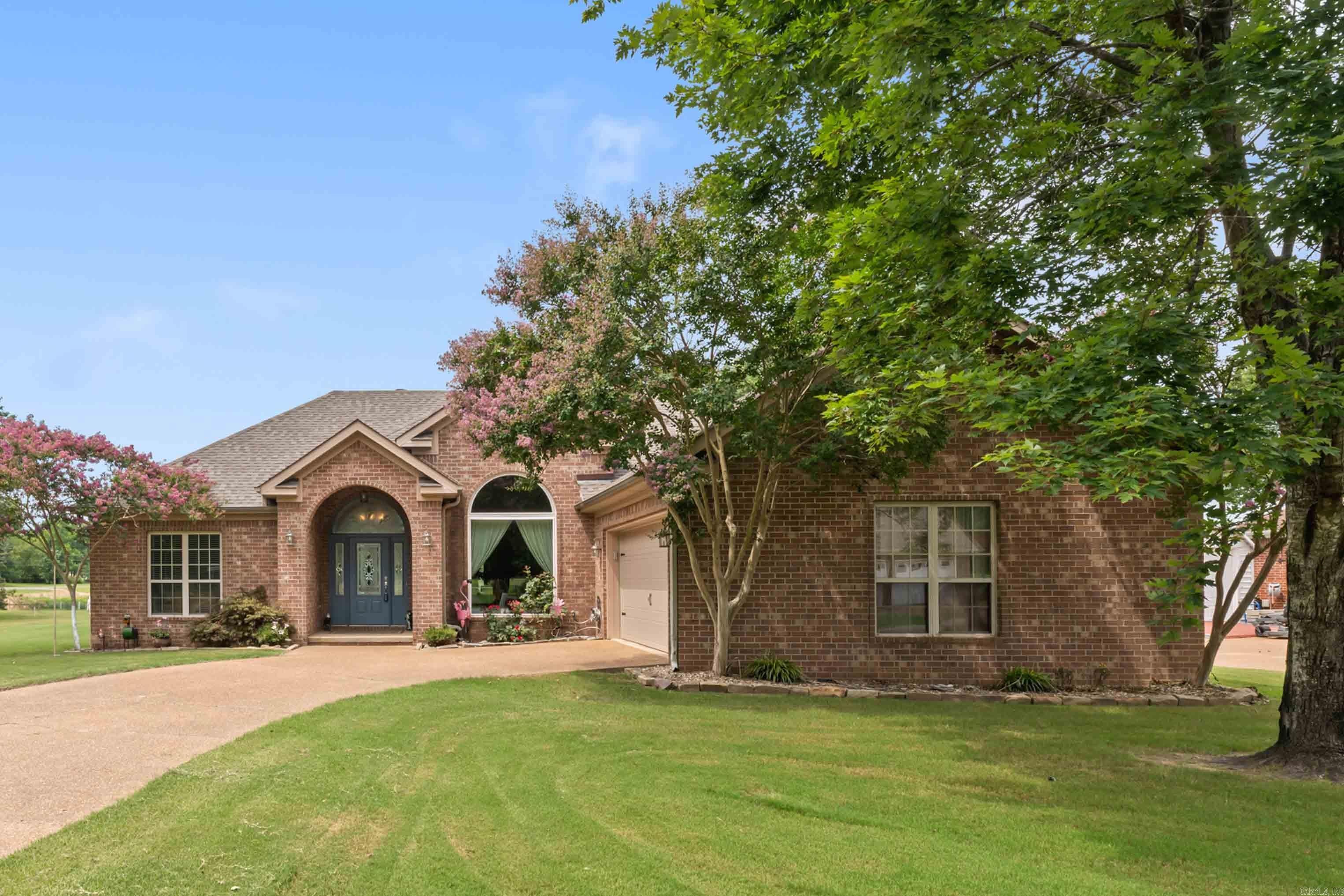Enjoy peaceful waterfront views from this beautifully updated all-brick home in the private Lost Creek Subdivision, where neighborhood charm meets country appeal. Overlooking a scenic pond with a fountain and beautiful views of Sugarloaf Mountain, this 3BR/2BA home features an open living and kitchen design filled with natural light from expansive windows. The kitchen offers granite countertops, abundant cabinetry, a new refrigerator, and new dishwasher, while warm wood floors add timeless appeal. Extensive updates include a new roof, HVAC, energy-efficient windows, garage door, remodeled primary bath with a custom walk-in shower, whole-house generator, and more, making this home truly move-in ready. Relax on the deck and enjoy the tranquil setting, just minutes from the Little Red River, Greers Ferry Lake, shopping, dining, and medical facilities in Heber Springs. An additional 13.66± acres with a newly constructed home is also available, creating a rare opportunity for a family estate or investment.