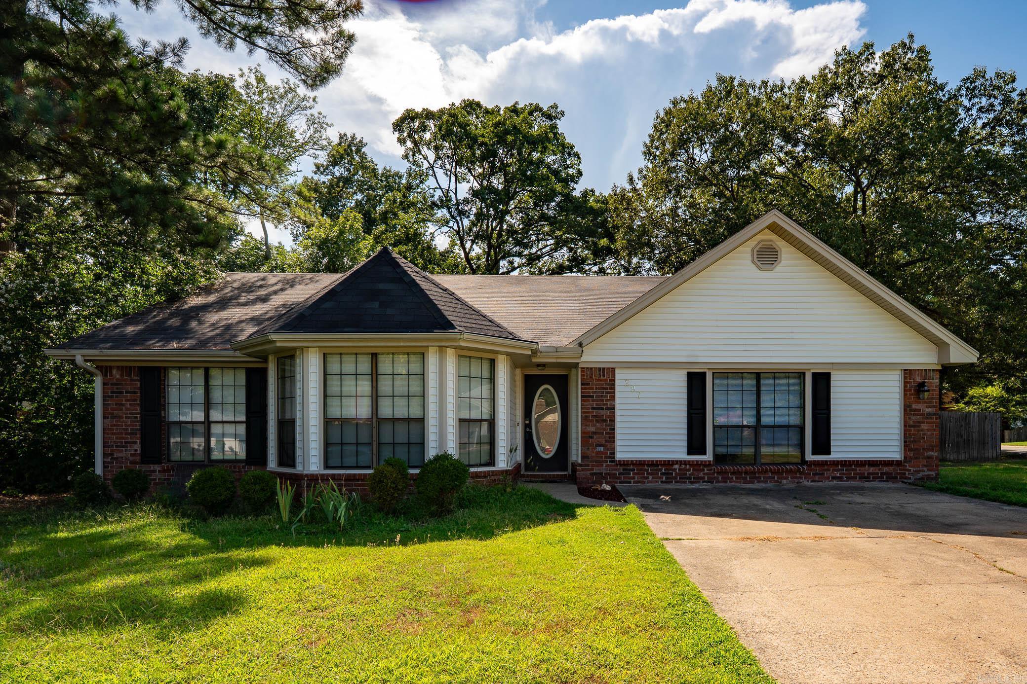 Spacious and well maintained, this 3 bedroom, 2 bathroom home offers 2,099 square feet on a desirable corner lot in the heart of Conway. Conveniently located just minutes from the University of Central Arkansas, shopping, dining, schools, and parks, this home combines comfort, functionality, and location.  Inside, you’ll find a split floor plan designed for privacy and everyday living. The living room features vaulted ceilings, a cozy fireplace, and plenty of natural light, creating a warm and inviting atmosphere. A large bonus room provides flexible space for a home office, playroom, second living area, or guest retreat.  The kitchen and dining areas flow seamlessly together, making the home ideal for both entertaining and daily life. Additional interior storage rooms provide extra convenience and organization.  Step outside to enjoy the covered patio and fully privacy fenced backyard complete with a storage shed and plenty of room to relax, entertain, or play.  Located in an established neighborhood near UCA, this home offers the space and versatility buyers are looking for in one of Conway’s most convenient locations. Schedule your private showing today!