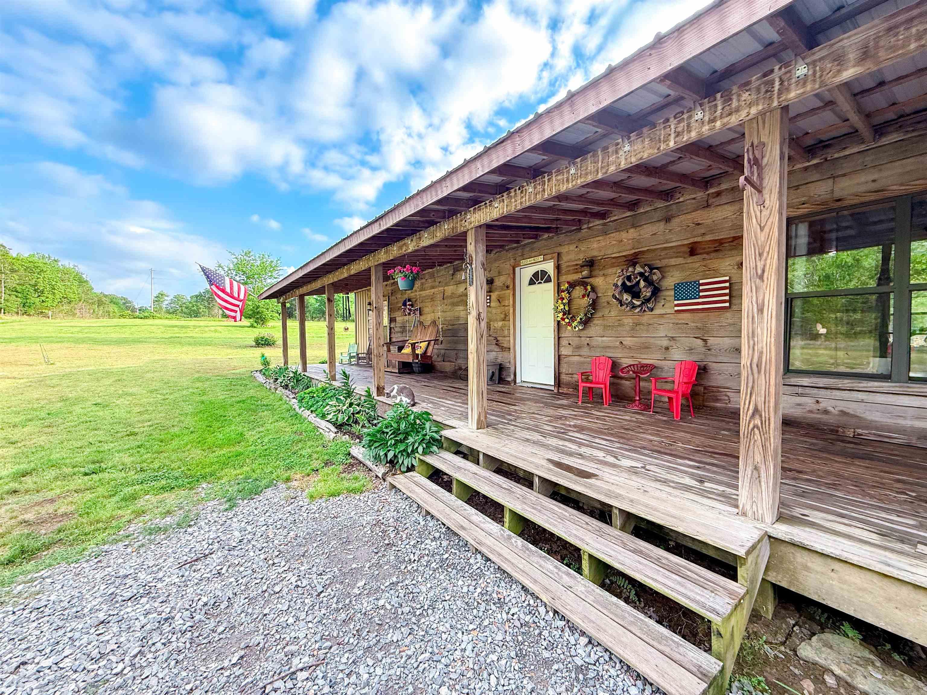 Rustic charm meets modern comfort in this beautiful 3 bedroom, 2 bath home with an office, situated on 2.51 +/- peaceful acres. From the inviting porches to the spacious open-concept interior, this home offers the perfect blend of country living and updated style. Inside, you’ll find a stunning new kitchen with gorgeous countertops, new appliances, abundant cabinetry, and plenty of prep space. The vaulted living area features soaring ceilings and luxury vinyl flooring throughout. The spacious primary suite offers a relaxing retreat, while the dedicated office provides the perfect work-from-home setup. Additional features include a laundry room, two storage sheds for extra storage, and plenty of room to enjoy the outdoors. Bring your RV and utilize the 50amp electric hookup outside. This home is approximately 15 minutes from Fairfield Bay Marina & the beautiful Greers Ferry Lake. If you’ve been looking for space, style, and privacy—this one checks all the boxes!