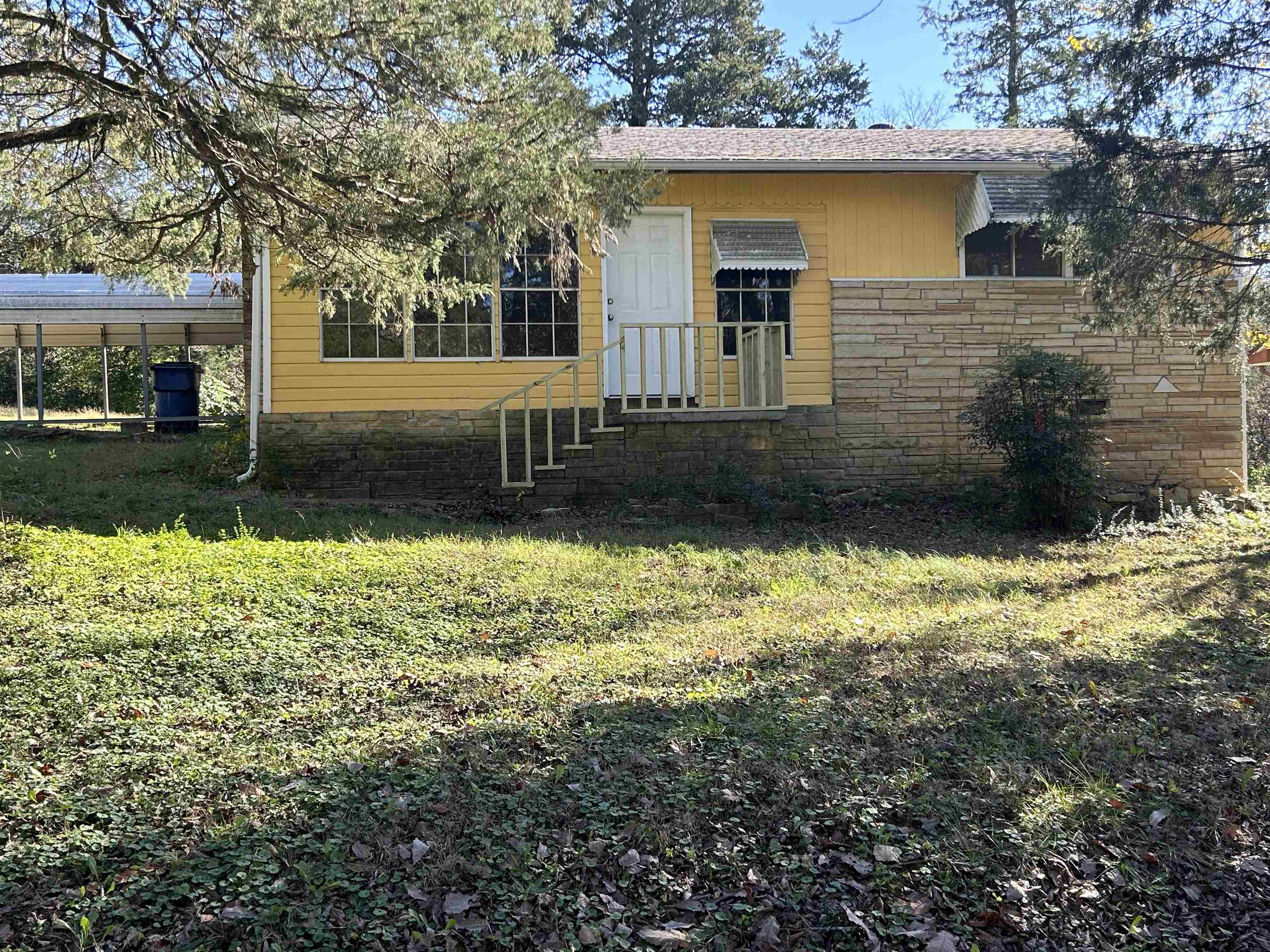 Avail July 1st. Spacious 2 Bedroom 1 Bath with bonus (sun) room.  Walk-in closet, Large eat-in kitchen with lots of cabinet space. Newer flooring throughout-no carpet.  Large living room with wood-burning fireplace.  New Central H/A. Two-car metal carport. Storage room or work shop. Covered patio - all on a corner lot. Each adult (18+) is required to complete an application. Credit and criminal background checks. $39 is added to rent to cover pest control, liability insurance & credit reporting services.