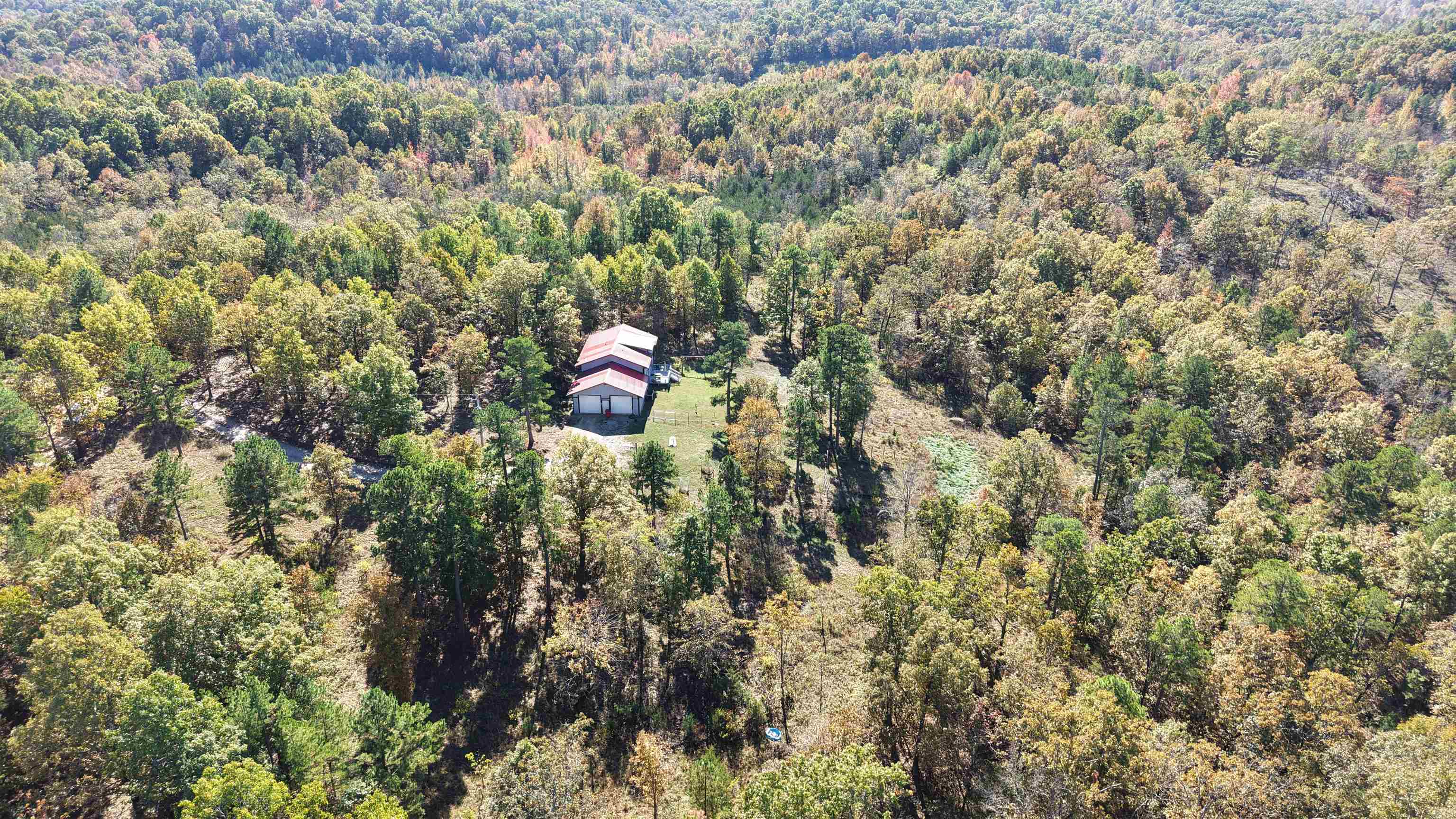 This spacious 3-bedroom, 2-bathroom home is nestled on 10 scenic acres just 5.4 miles from the town of Melbourne, Arkansas. Enjoy the privacy and rural charm  of this property, all while being within minutes from schools, shopping, dining, and other local amenities.  The land offers a beautiful mix of open and wooded land, providing space for gardening, recreation, hunting, or hobby farming—all while soaking in the panoramic Ozark Mountain views. This 2,400 sq. ft. home features a two-car garage, a warm country atmosphere, and numerous modern updates — including a new central heat and air system with heat pump, new appliances (all included), and a gas water heater. For added comfort and convenience, propane wall heaters are also installed with a propane tank that conveys with the sale. Two bedrooms and a full bath are downstairs. Upstairs is a loft that includes a private bedroom, walk-in closet, and a brand-new walk-in tile shower—making it an ideal master suite. Additional walk-in closets throughout the home provide ample storage and organizational space. This home offers comfort, space, and Ozark tranquility—all priced to sell for $299,900.