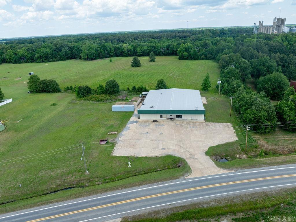 Prime Commercial Opportunity on Hwy 38 in Des Arc!  Impressive 12,648+/- square foot building situated on approximately 1 acre, with an additional acre available for expansion for future development.  This versatile property features 2,200 square feet dedicated to heated shipping/warehouse space, with the remaining square footage fully heated and cooled, making it ideal for a wide range of commercial or industrial uses.  Inside, you'll find 5 private offices, offering a functional layout for administrative and operational needs.  Located in a high-visibility area on Hwy 38, the property includes approximately 30 paved parking spaces, providing convenience for employees and customers alike.  This property offers the space, flexibility, and location to support a variety of business opportunities!