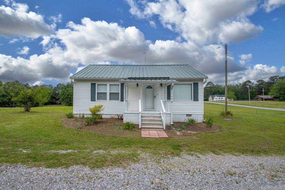 This cozy home has been completely renovated throughout and features an open floor plan on a spacious acre corner lot. Perfect for anyone looking for comfort and room to enjoy country living! Enjoy the natural light beaming throughout the home, or relax outside and take in the peaceful setting just outside the city limits.