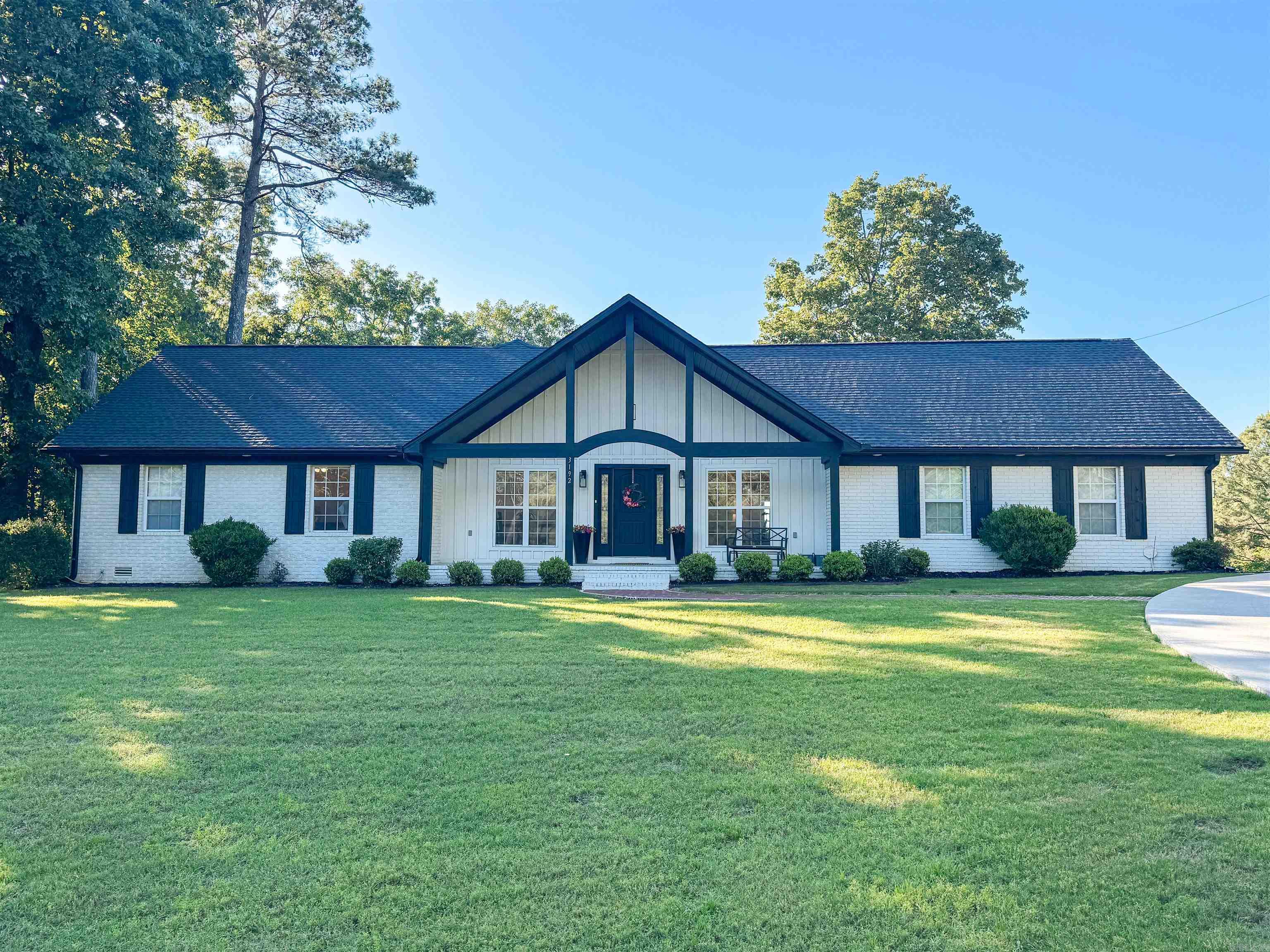 You've got to see this gorgeous home west of Searcy with stunning views and perfect spaces for entertaining both inside and out! This home was completed gutted down to the studs with all new EVERYTHING in 2022. Providing versatile spaces for living areas and dining areas with a large open foyer that leads to a spacious dining room and living room, the hosting possibilities are endless! The kitchen features a large island with an over-sized kitchen sink, pantry, 5-burner gas stove, granite countertops with custom backsplash, and stainless vent hood. Off the kitchen you'll find a stunning keeping room/breakfast area boasting vaulted wood ceilings and ample natural light! Two bedrooms & 2 1/2 baths are located downstairs including the primary suite featuring a double vanity & custom tile shower with 2 shower heads, & a great closet. Two bedrooms & one bath are upstairs including an extra bonus room or spacious playroom that could be used as a potential 5th bedroom. Enjoy relaxing views from the deck in your private backyard with a crafted brick sidewalk leading to the approach. Guests have easy access and convenient parking in the front circle drive! Call now for your personal tour!