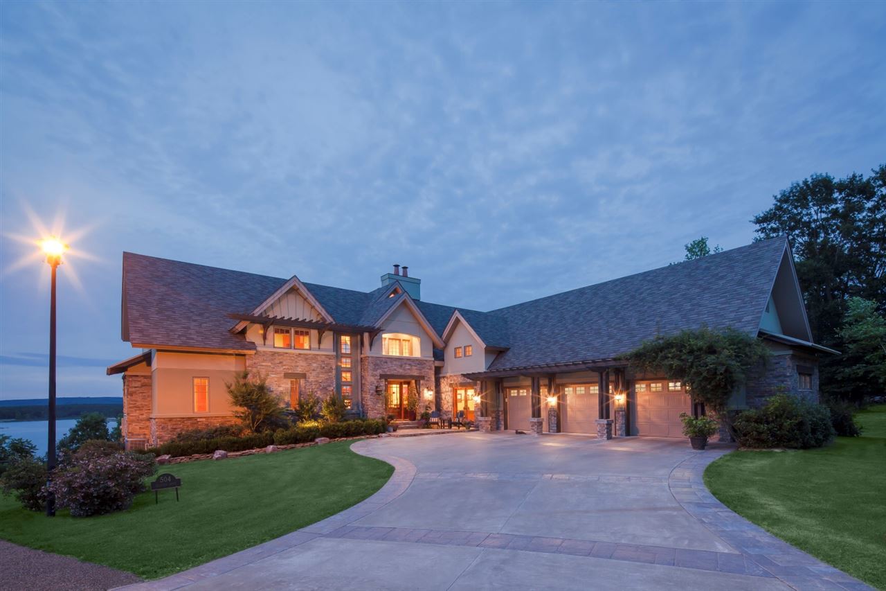 Not just a lake home in Heber Springs... THE lake home in Heber Springs! This amazing home was featured in Arkansas Life magazine and truly has some of the most gorgeous views of Greers Ferry Lake you will find.  5 bedrooms, 4 1/2 baths, 3 car garage, office, 2 fireplaces, walkout basement with its own living area, additional master suite, a bar and theater room.
