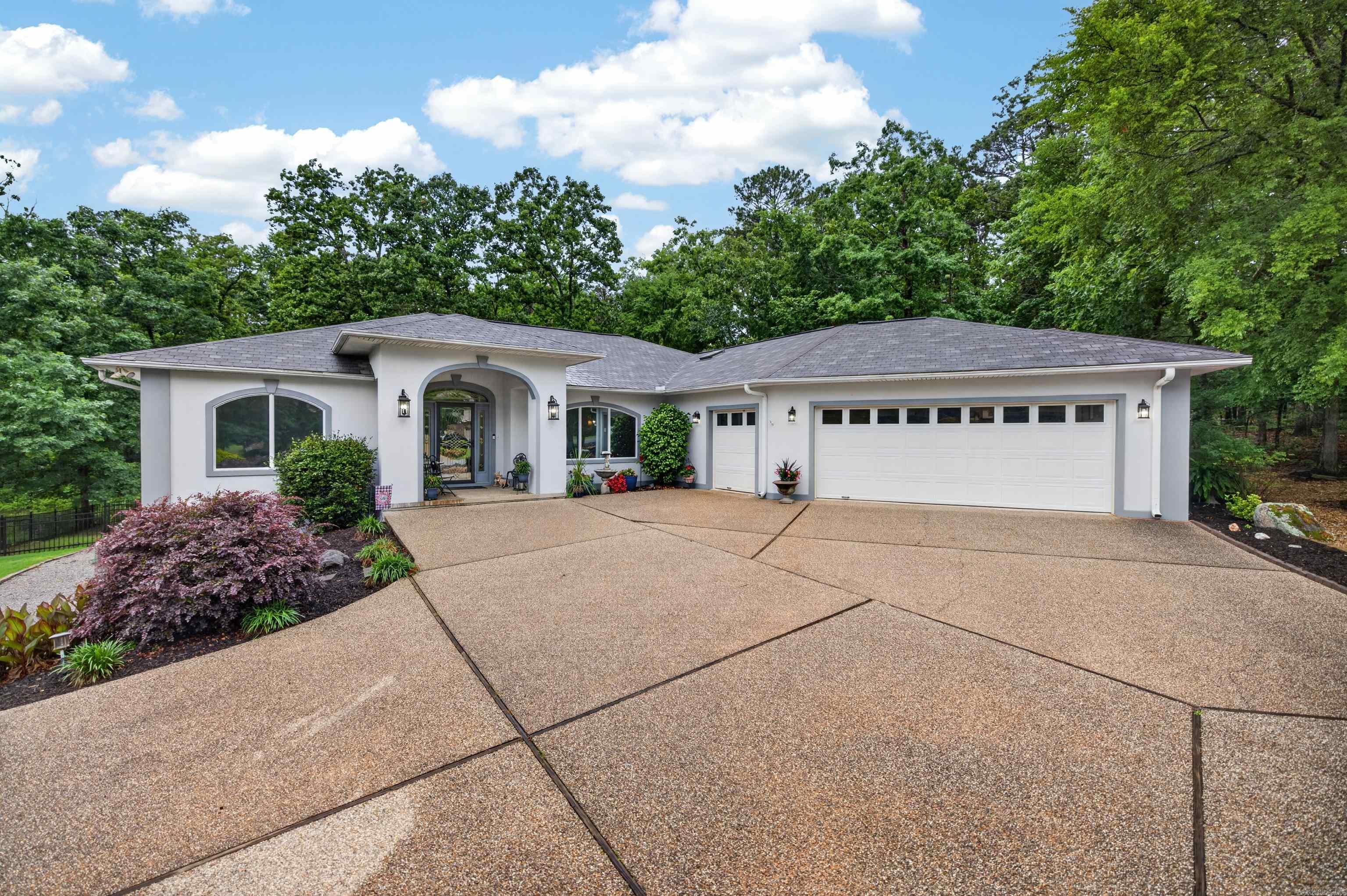 WOW!  This completely updated one-level home built by Ben White is unbelievable.  Located in the Village's only private country club, this gold membership property is located just across the street from the 18th fairway and is only a minute and a half from the Diamante clubhouse!  Entering through the front door you will find a very open floor plan featuring cathedral ceilings, new flooring and paint throughout, a completely remodeled master bath, a three-way gas fireplace, a brand new Arkansas Room with 594 square feet that is not included in the 2,740 square feet listed, a wonderful guest bath including a walk-in tub, and a heated and cooled man cave!  The kitchen includes new appliances and breakfast bar.  The large storage area underneath the home is partially floored. There are many, many updates - agents see remarks for a full list.  Owner will consider paying the required Diamante transfer fee and initiation fee, totaling $10,500, with acceptable offer.  It's priced below market and will move quickly.  Call or text listing agent today for a showing - 501.912.4575!