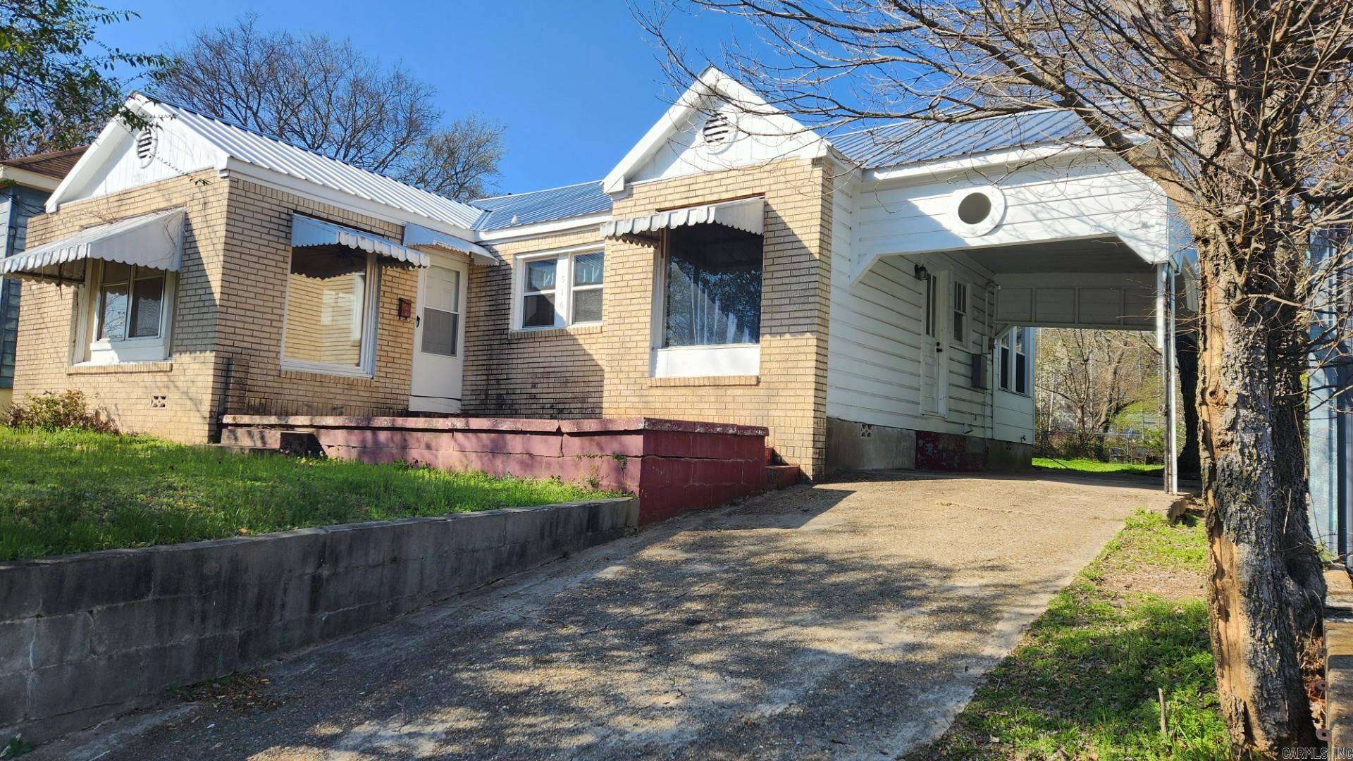 Great investment opportunity or for small family. Yes, it needs work but all the main things have already been done. This 2 bedroom, 1 bath home has 1008 sq feet under a great metal roof. Updated wiring, ch/a, brand new hot water heater. Most of the windows have been replaced, new front storm door, new serwer line from house to street, laminate floors throughout. Now just waiting for new a new owner to finish the rest. Great level back yard partially chain link fenced. Great location close to downtown & bypass. Within walking distance to shopping and bus line.