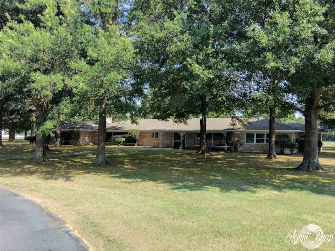 Get lost in this wonderful home with a large kitchen, dining room, den, family room, work out room plus a bonus room.  Hardwood & terrazzo floors, pellet stove in den & a wood burning fireplace in family room & 60W generator.  40x60 shop heated & cooled with 1/2 ba., & a 50x60 shop, 2 gated entries, metal fencing surrounds property.   All of this sitting on 40 acres +/-.  Heated & cooled Sq Ft 7163 Sq. Ft. approx. measuring encouraged.  Additional 8 acres parcel #001-05702-000 ~ SEE AGENT REMARKS