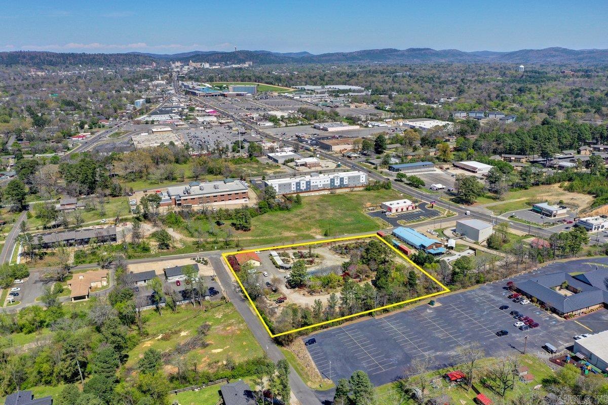 Investors Take note!! If you have been looking for the perfect location to put in a business-Check out this PRIME location! 3+ Acres one block off Central Ave (7 S) And Higdon Ferry road. With all the growth and development taking place right now, this is a highly desired easily accessible property. The possibilities for this property are almost limitless. Zoned C4 Neighborhood Commercial it is located only mins to Oaklawn Race Track & Casino. Along with the 3+ acres are a 2000 sq ft office building, a 40X50 building (which is being used as storage. See the sketch in the photos. Built in 2011 at a cost of $50,000. Close to Lake Hamilton, to all amenities, banks, grocery,fine and fast food dining. Minutes to hop on the bypass and be headed to Hot Springs Village, Little Rock, Texarkana, etc. Hot Springs is no longer a hidden secret, the word it out. Lovely town to vacation, with beautiful lakes, downtown area with shopping. Bath House Row, Promenade. Mid America Park Museum, Garven Woodland Gardens.