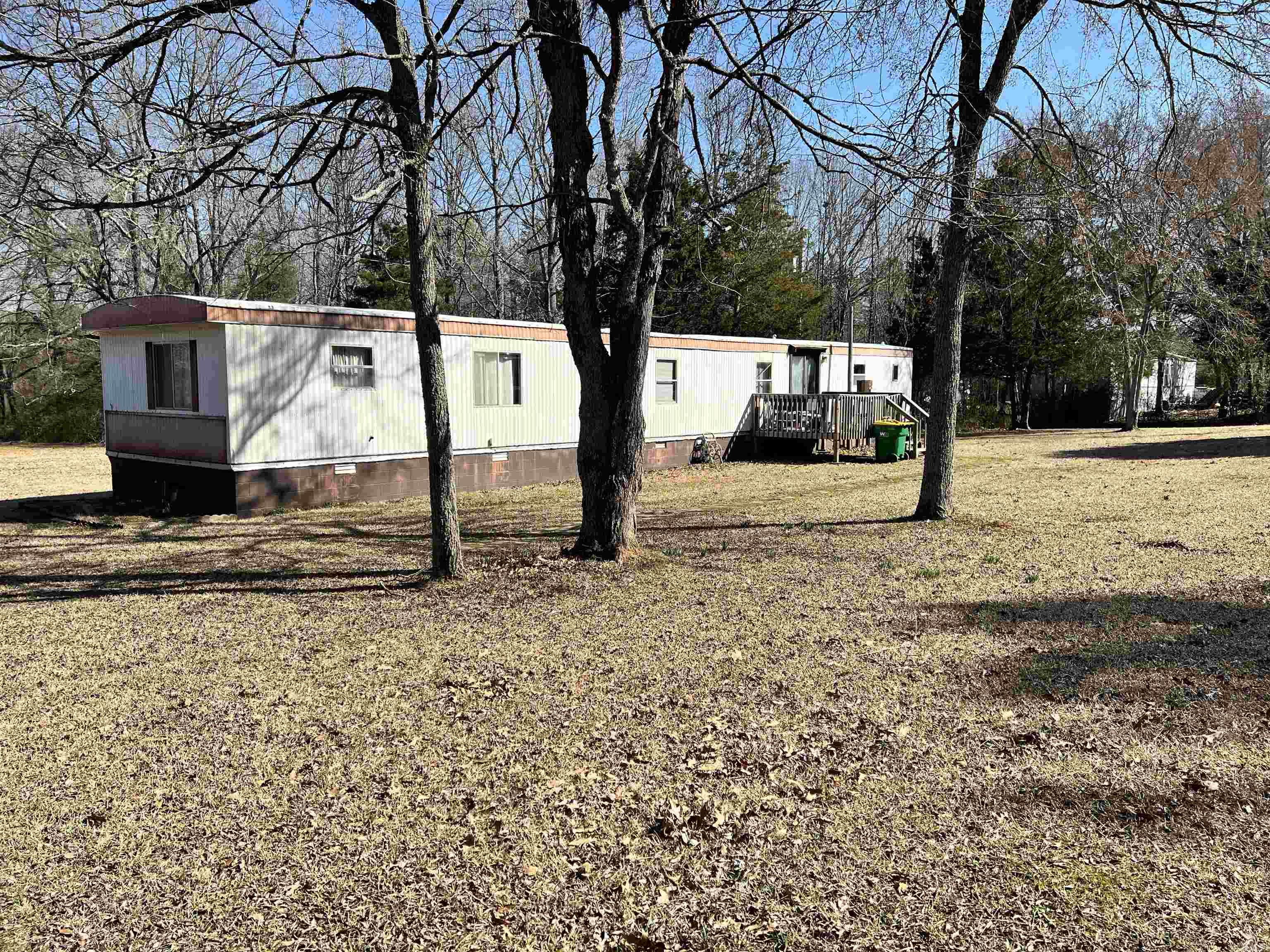 Looking for land with options? This 3.74-acre multi-lot package in Jacksonville offers flexibility that’s hard to find at this price point. Located on Lena Lane and Grace Lane, the property includes 11 separately parceled lots, creating opportunity for a private setup, long-term investment hold, or future plans—subject to septic approval and buyer verification.  A 3-bedroom mobile home is already on site and connected to utilities and septic, providing a starting point for renovation, rental potential, or interim use. The home is being sold as-is and will require repairs, making this ideal for cash or conventional buyers seeking value. With mostly level ground and natural surroundings, this Jacksonville property presents a rare chance to control multiple parcels for $100,000 and shape the possibilities over time.