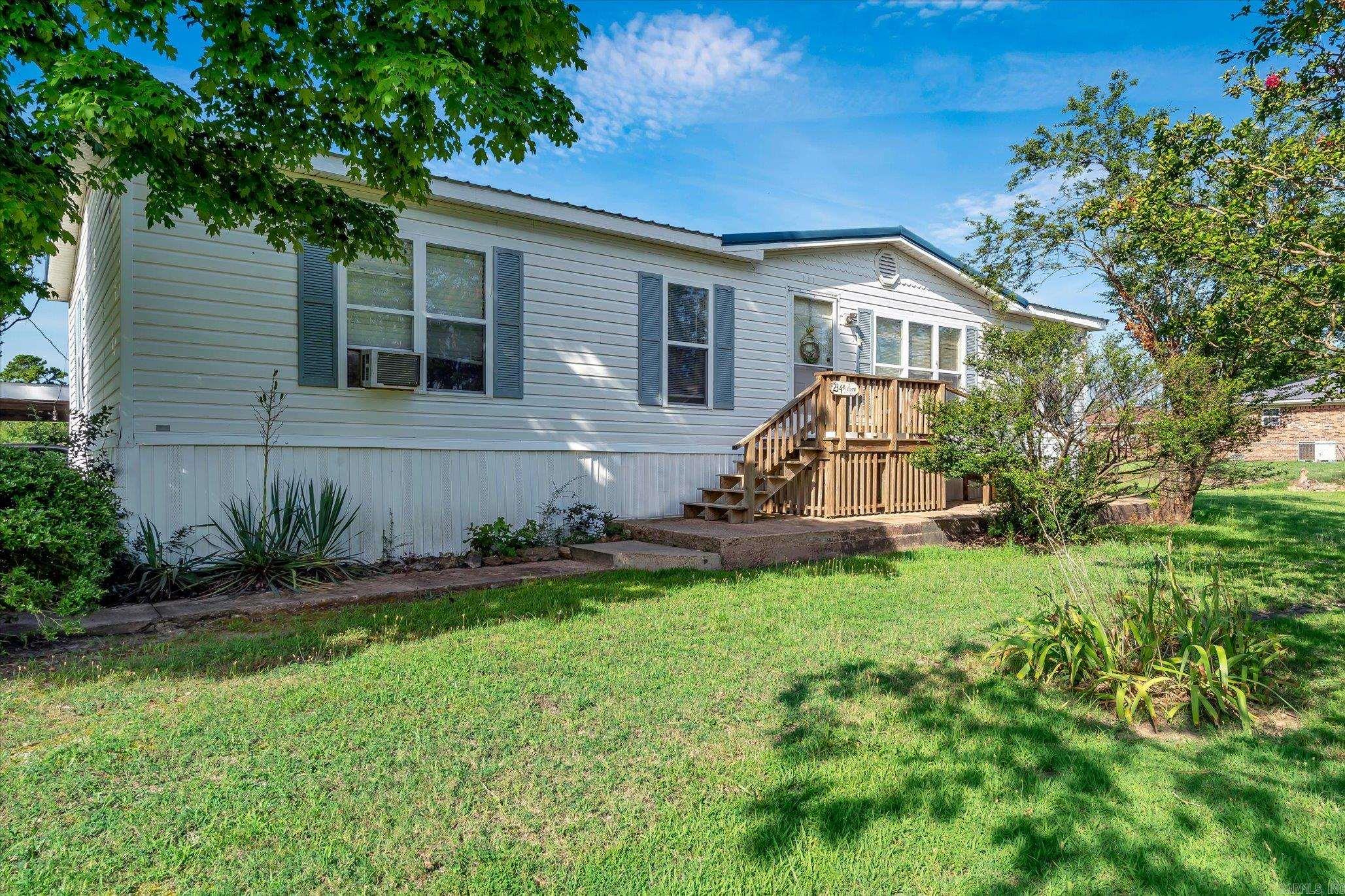 This well-maintained 3BD 2BTH double-wide home is packed with features for comfortable living. Recently updated with a new metal roof and a new furnace, both less than a year old, you can enjoy peace of mind knowing the major systems are like new. The spacious layout includes a large, covered back deck perfect for relaxing or entertaining, while  a handicap-accessible ramp to the front door ensures ease of access for all. Securely tied down and ready to make your own, this home combines functionality and charm in one affordable package!