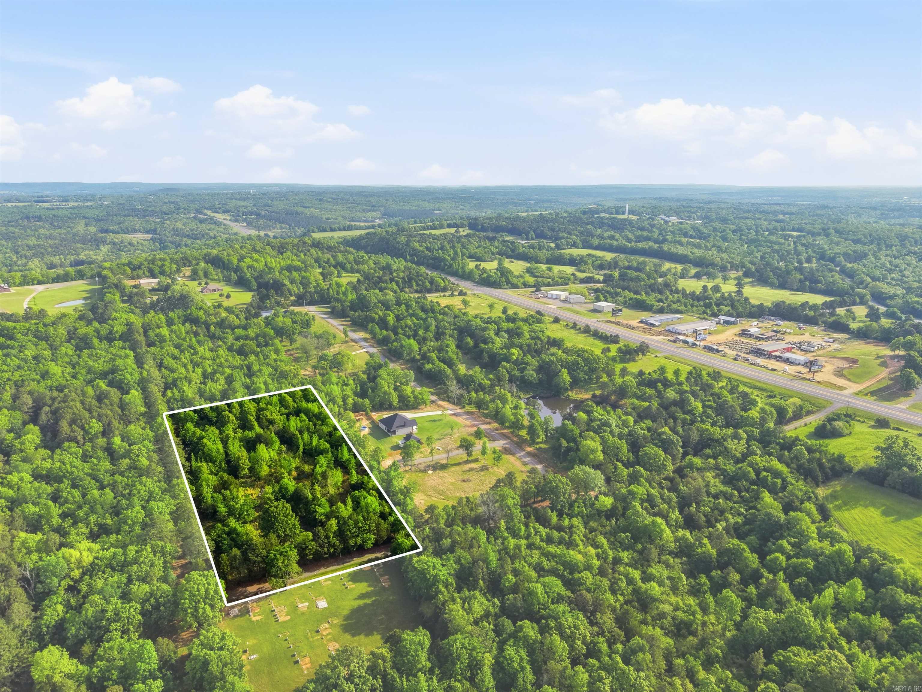 Builders take a look! 4 acres in Twin Groves across from Hillbrook Farms wedding venue. Utilities on site. Owner is working on clearing some of the trees and shrubs to get some building spots ready for you. Damascus water, Petit Jean Electric. Property is 8 minutes from Greenbrier and 24 minutes from Conway ensuring a wide range of amenities within a short drive. Seller is open to subdividing and owner financing. Parcel ID: 778-10989-002. No Mobile Homes. Barndominiums may be allowed with approval of floor plans.