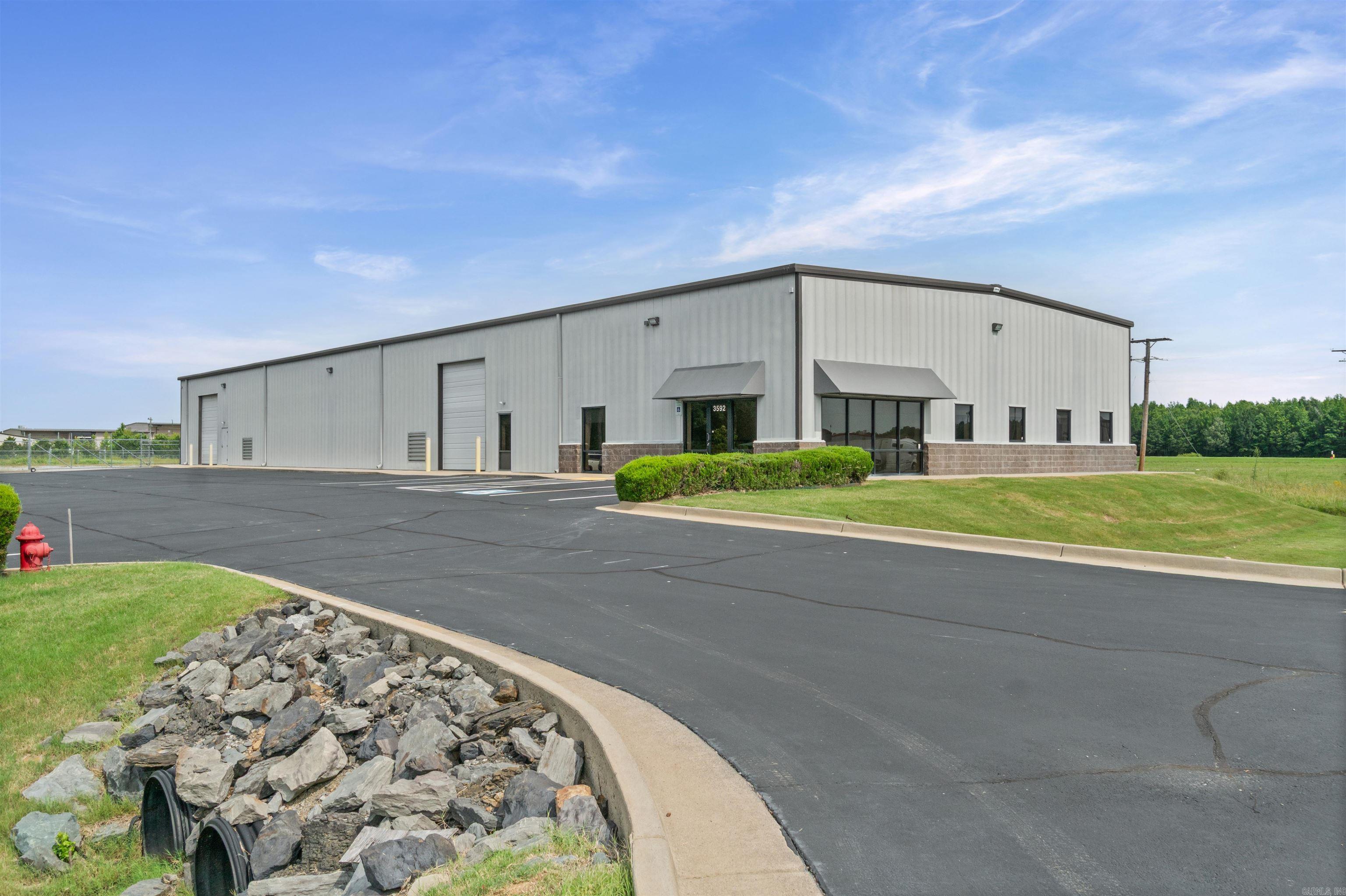 Premium commercial land and building with outstanding traffic counts, interstate visibility, ideal for logistics, retail or service-based operations. Located just off of Interstate Hwy I-57(formerly US-67) this exceptional maintained interior & exterior property offers heavy-equipment-ready shop area, reinforced flooring, 14ft & 16ft overhead doors and ample power for industrial use. Warehouse/shop space 8228 sq ft infrared heat & ventilated, office space 2332 sq ft heated & cooled. Extra land usable for expansion, outdoor storage or fleet parking. Spacious open floor plan with private offices, reception, waiting area ideal for customers, kitchen, 3 bathrooms and ample parking. Property only one mile from Searcy Regional Airport. Ideal for a growing business, call today for your personal tour. SEE AGENT REMARKS!