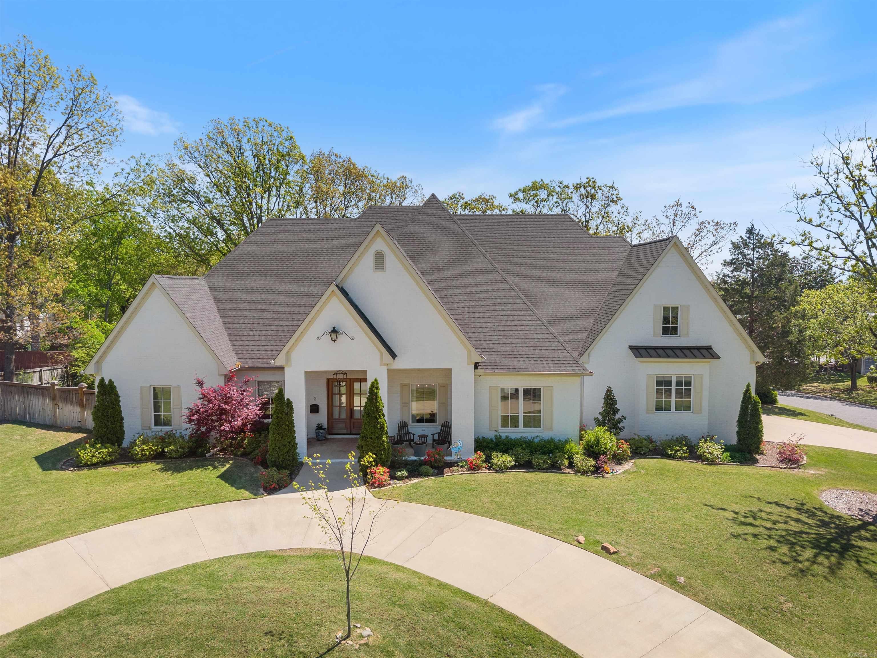 Stunning 2020-built home in Pleasant Valley offering timeless architecture and high-end finishes throughout. Located on a corner lot adjacent to the Pleasant Valley Golf Course, this 4 bedroom/4.5 bathroom home offers a wonderful floor plan. Main level highlights include: a formal dining room, office with French doors and built-in cabinets, and a great room with fireplace and beautiful custom cabinetry. The chef’s kitchen boasts KitchenAid appliances: a commercial gas range with pot filler, double ovens, built-in fridge/freezer, walk-in pantry, and a wet bar in the breakfast area. The main-level primary suite offers a spa-like bath and spacious walk-in closet. A guest suite is also on the main level. Upstairs has two bedrooms with private baths and walk-in closets, a large game room, attic access, and a 2nd laundry service. Outdoor features include a screened porch with fireplace, fenced backyard, circular drive, and side-entry 3-car garage. Additional features include: sight finished hardwood floors, 10’ ceilings and 8' doors on the main level, 9’ ceilings upstairs, Pella windows and doors, mud room and incredible main level laundry room with beautiful design! See agent remarks!