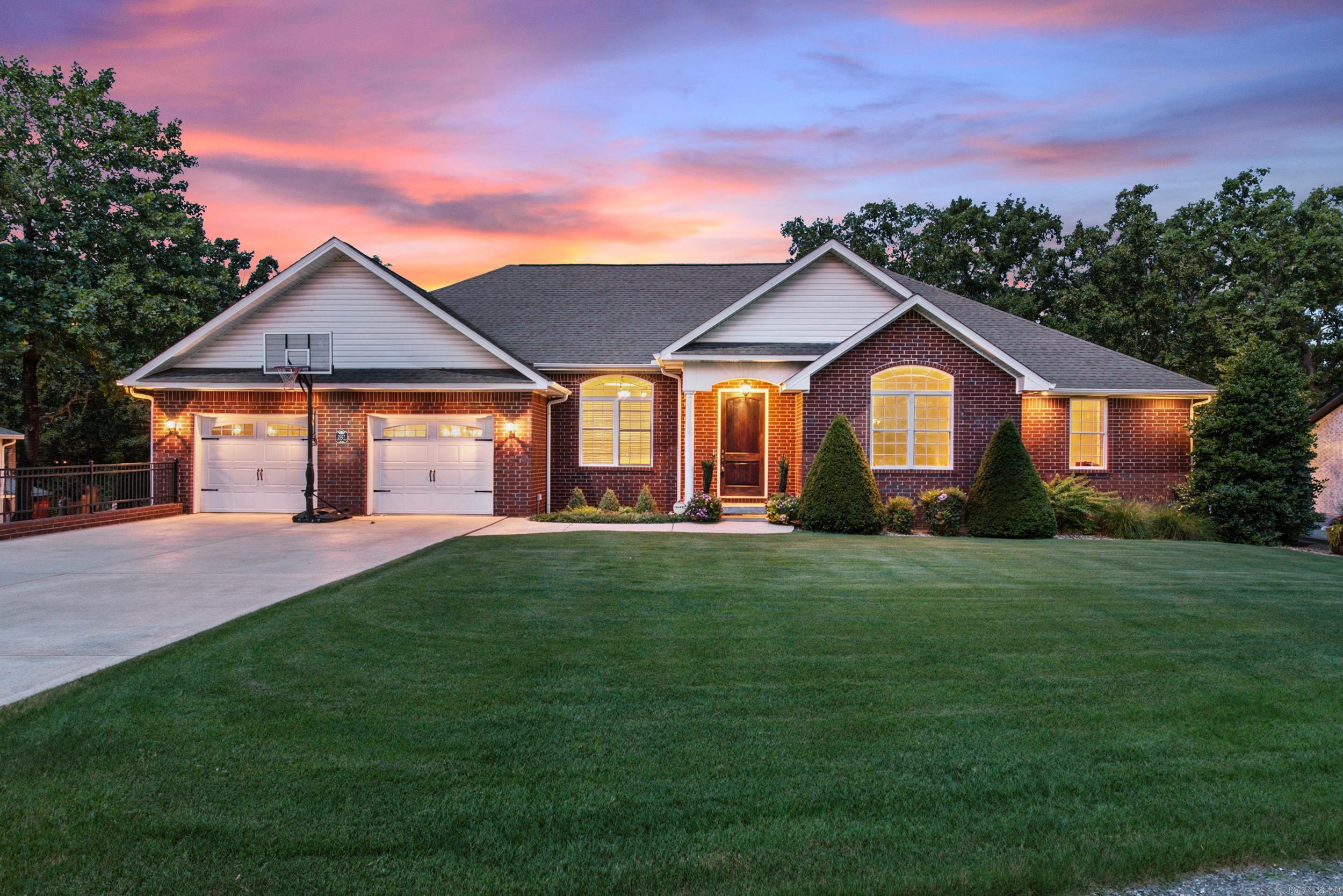 This spacious home in The Oaks subdivision is a Hole-in-One! Located on a quiet street near the Twin Lakes Golf Course, this beautifully designed one-owner home features 5-bedrooms, 3-bathrooms, tall ceilings, large rooms, and an abundance of storage.  The oversized kitchen provides ample cabinet and prep space for cooking and entertaining. The combination laundry/mudroom adds convenience and organization. The primary suite has a walk-in closet, double vanities and separate tub and shower in the ensuite bathroom. The walkout basement features a second living area, game room, wet bar, 2 bedrooms, 1 bathroom and additional storage. Enjoy outdoor living with a deck overlooking an inviting backyard patio with flagstone firepit. A heated & cooled workshop bay on the lower level provides excellent space for hobbies, tools, or additional storage.