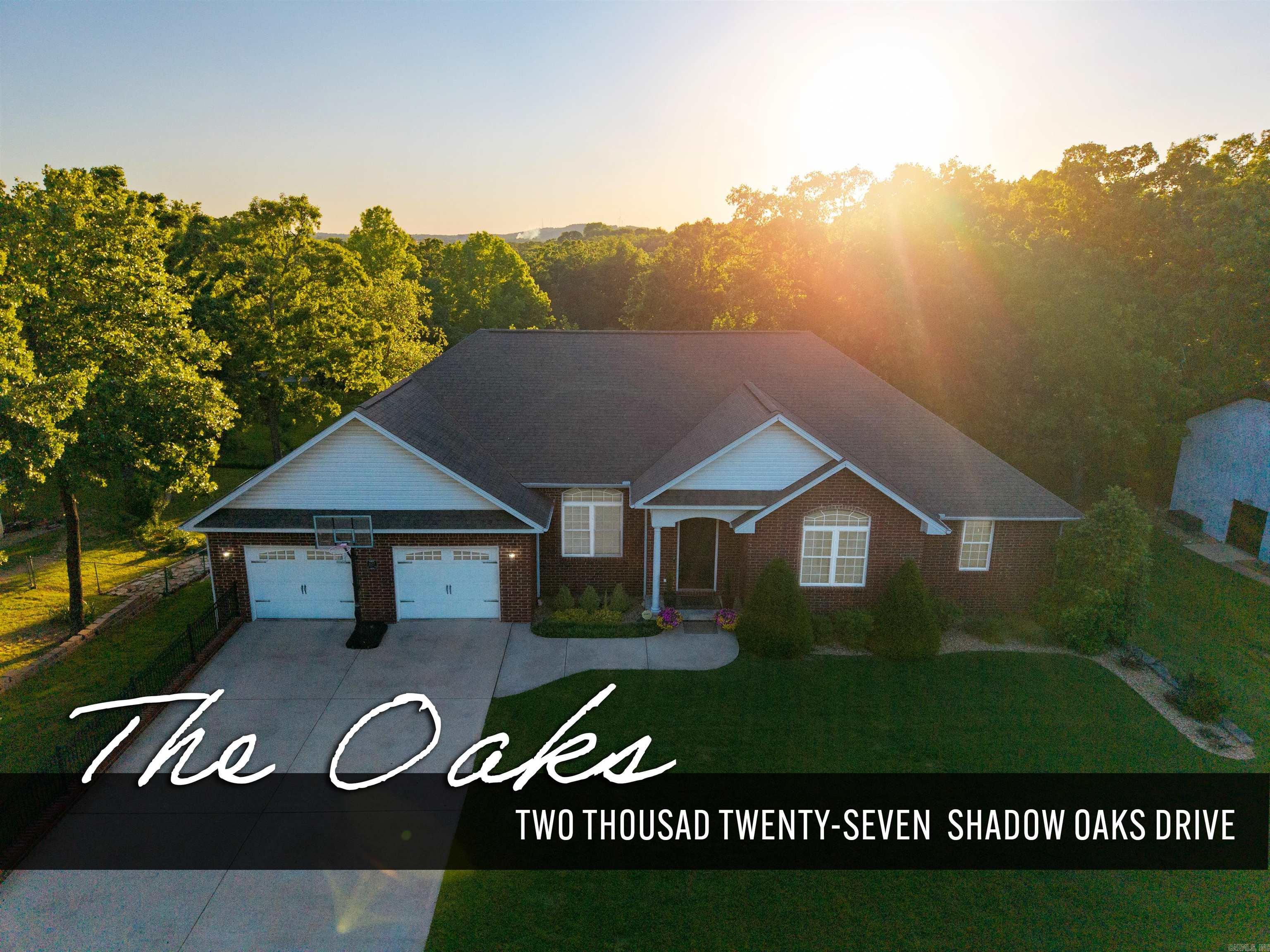 This spacious home in The Oaks subdivision is a Hole-in-One! Located on a quiet street near the Twin Lakes Golf Course, this beautifully designed one-owner home features 5-bedrooms, 3-bathrooms, tall ceilings, large rooms, and an abundance of storage.  The oversized kitchen provides ample cabinet and prep space for cooking and entertaining. The combination laundry/mudroom adds convenience and organization. The primary suite has a walk-in closet, double vanities and separate tub and shower in the ensuite bathroom. The walkout basement features a second living area, game room, wet bar, 2 bedrooms, 1 bathroom and additional storage. Enjoy outdoor living with a deck overlooking an inviting backyard patio with flagstone firepit. A heated & cooled workshop bay on the lower level provides excellent space for hobbies, tools, or additional storage.