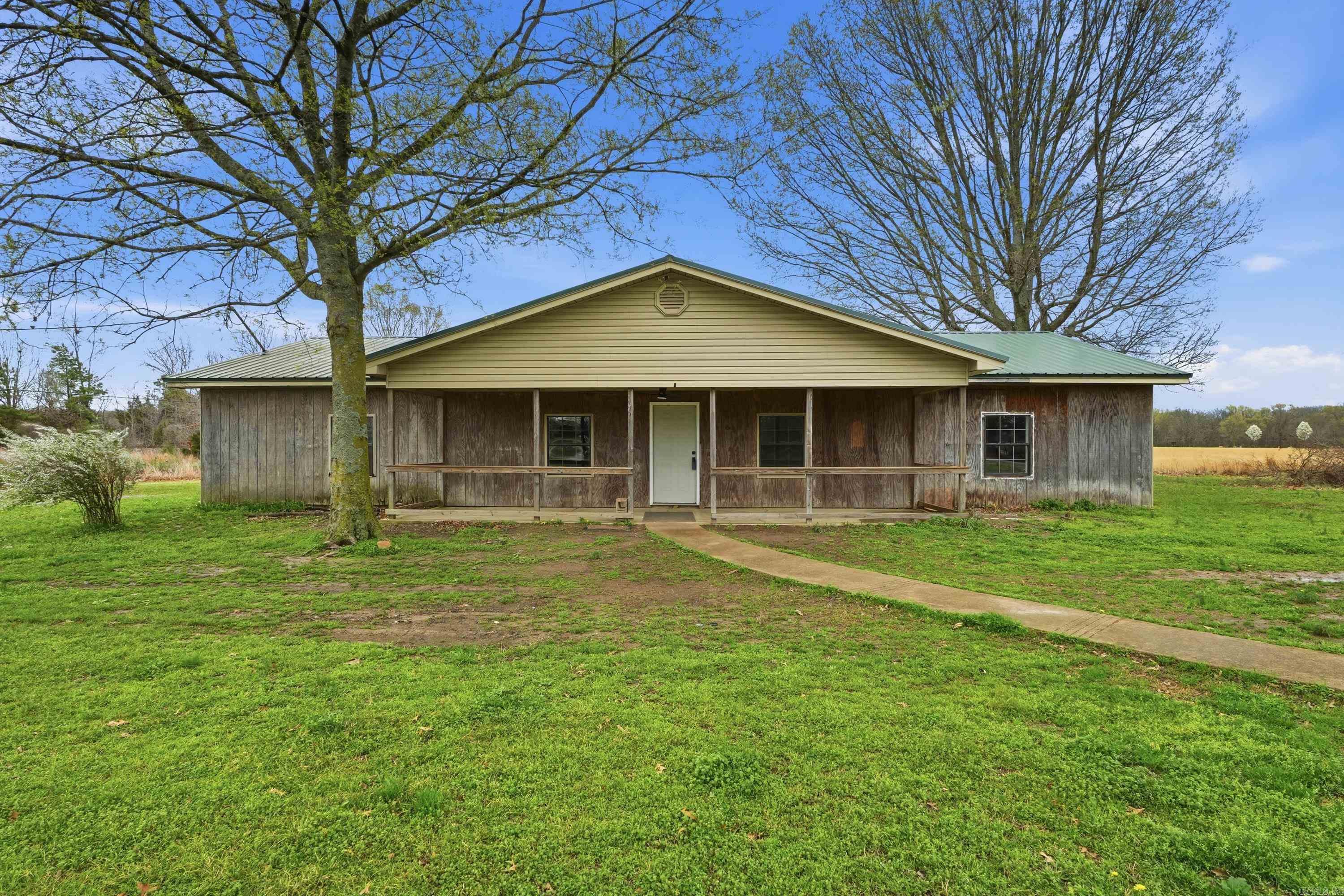 103 Hurricane Lake Road in Bald Knob, Arkansas offers the perfect blend of rural charm and outdoor adventure. Located just minutes from Hurricane Lake Wildlife Management Area, this property provides convenient access to some of the best duck hunting, fishing, and outdoor recreation in the region. Whether you are an avid outdoorsman, hunter, or simply looking for a peaceful retreat, this location offers the opportunity to enjoy the natural beauty and recreational opportunities that make this area so desirable. This 3 bedroom, 2 bathroom home also features a bonus room, giving you additional space for an office, game room, or guest area. Recent updates include a new metal roof installed last summer, an HVAC system and water heater that were both replaced approximately three years ago, and the septic system was pumped last year.   Sellers are willing to address some new outside wood covering the home where needed as well as replace windows and any other appraiser required repairs!  Come take a look today!