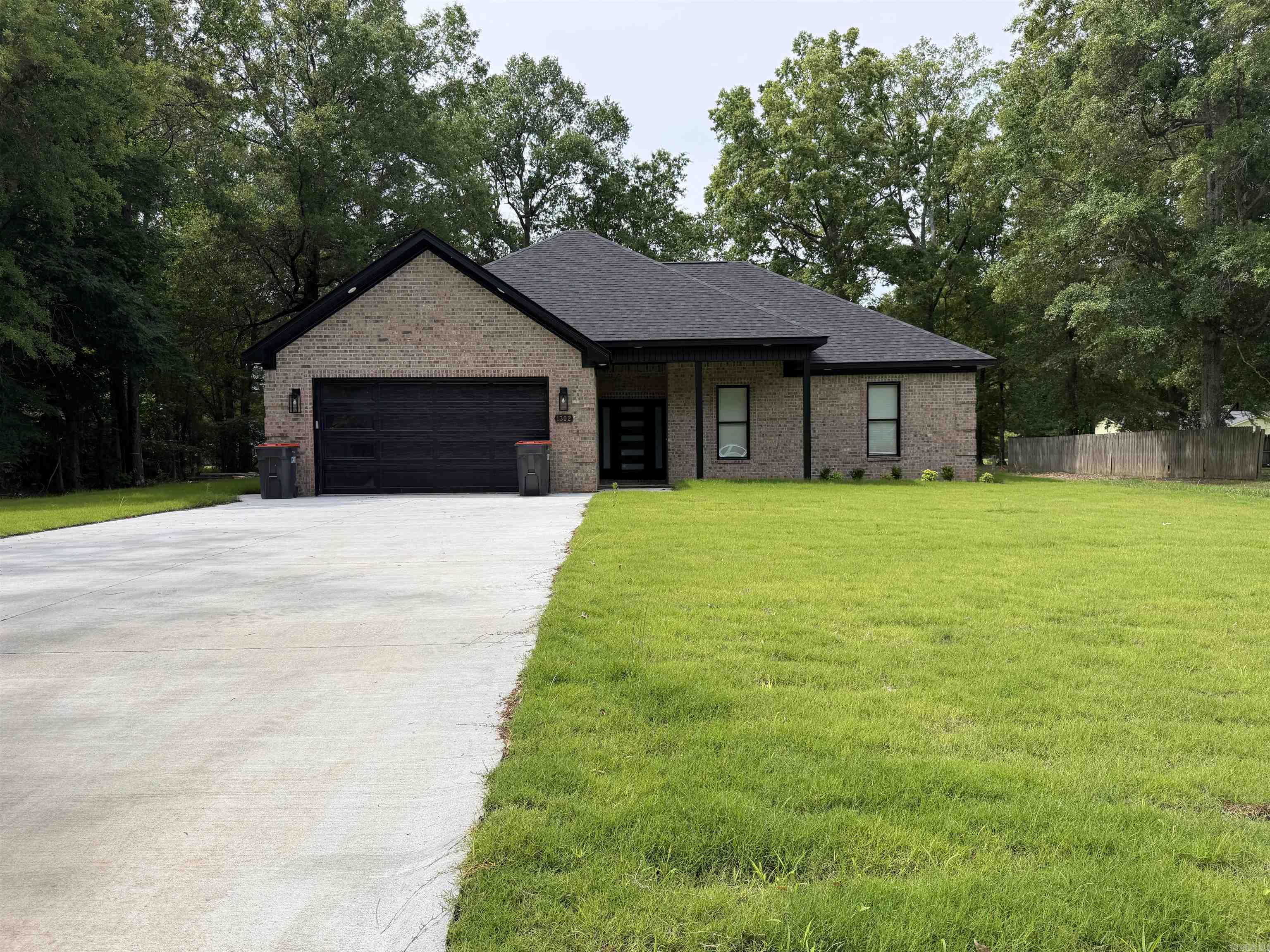 This beautifully crafted new construction home offers the perfect blend of comfort, style, and thoughtful design. Featuring three spacious bedrooms and two well-appointed bathrooms, every detail has been carefully considered to create a truly inviting living space. Situated on a gorgeous lot, the property is enhanced by professional landscaping and elegant soffit lighting that adds both charm and curb appeal, day and night. Inside, the open-concept kitchen flows seamlessly into the main living area, making it ideal for entertaining or everyday living. The large master suite serves as a private retreat, complete with a luxurious soaker tub and a beautifully tiled walk-in shower. Stunning flooring runs throughout the home, tying each space together with a polished, modern feel. With no detail overlooked, this home combines quality craftsmanship and stylish finishes to deliver a space that is as functional as it is beautiful. Taxes are based on vacant lot.  Measure square footage for accuracy.