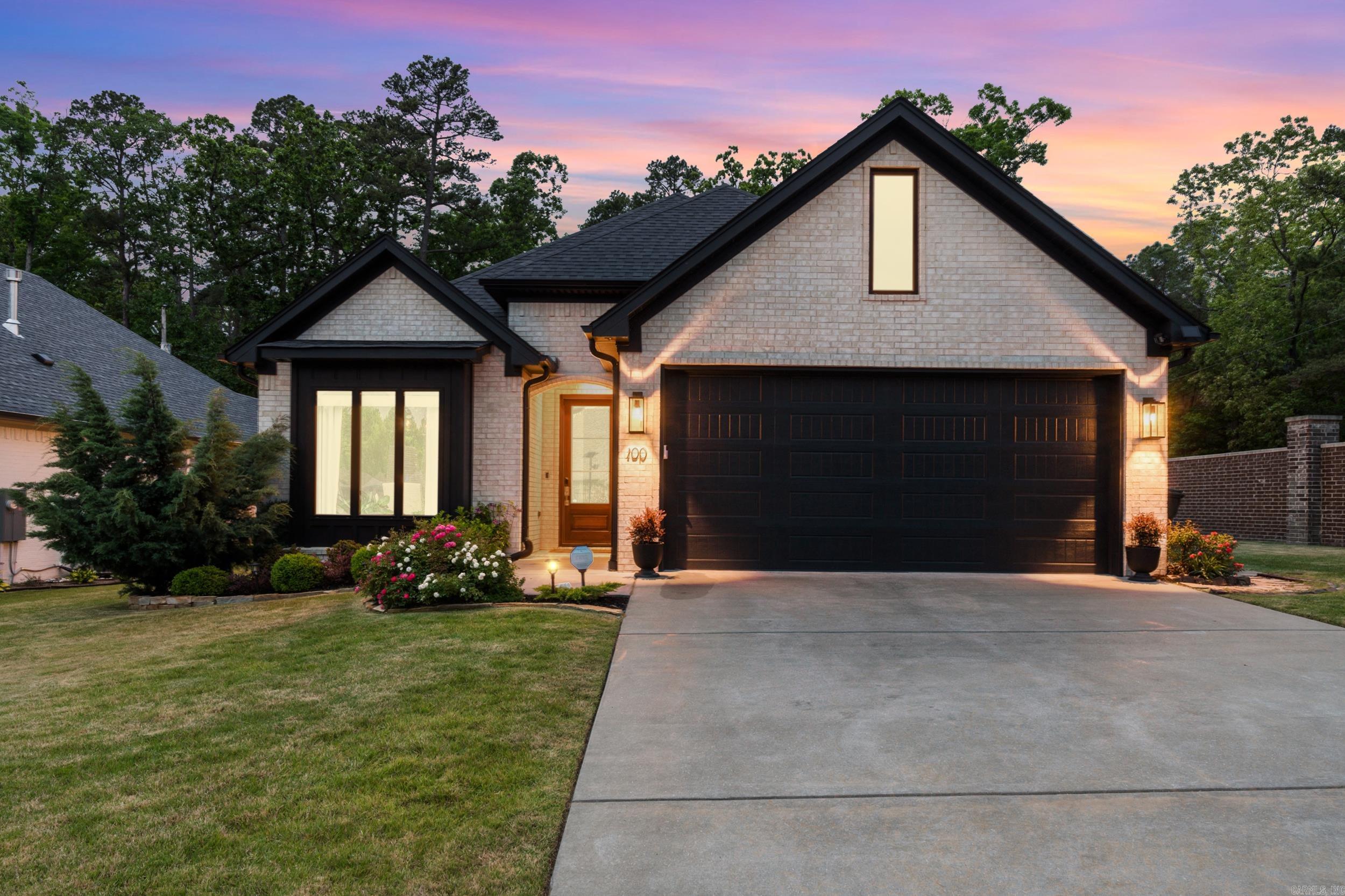 Tucked away near Chenal Parkway, this beautifully designed home blends comfort, quality, and privacy in one exceptional setting. Surrounded by mature landscaping and a peaceful wooded backdrop, the property offers a quiet retreat while still being close to shopping, dining, and everything West Little Rock has to offer. Inside, you'll find thoughtful upgrades throughout including luxury vinyl plank flooring, vaulted ceilings and archways, custom cabinetry, built-in bookshelves, and stunning solid wood 10-foot doors that add warmth and character to the space. The kitchen is equipped with stainless steel appliances and designed for both everyday living and entertaining. The spacious primary suite features a large walk-in closet, while additional upgrades such as energy-efficient windows, a tankless water heater, MyQ smart garage opener, and wired alarm/security systems provide modern convenience and peace of mind. This home offers the perfect balance of timeless craftsmanship, functionality, and natural beauty.