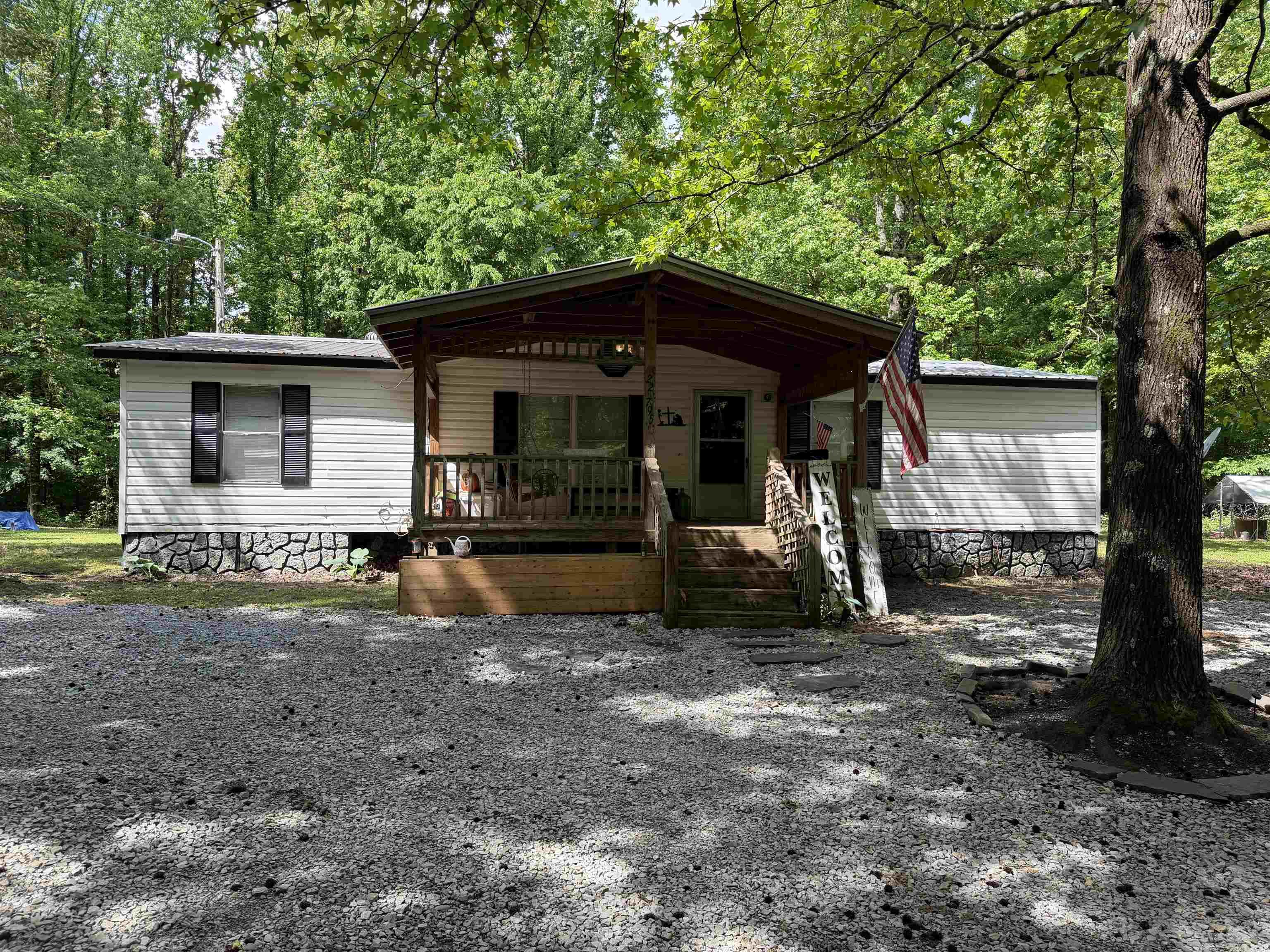 4 bedroom 2 bathroom Home on 5 secluded acres  Nestled on approx 5 acres. thi 4 bedroom 2 bathroom property offers the perfect blend of privacy and functionality. The home sits on 2 acres and is surrounded by 3 acres of beautiful wooded land, creating a peaceful secluded setting.  This property is ideal for those needing workspace or extra storage featuring 2 large shops with electricity 26x30 and 24x30