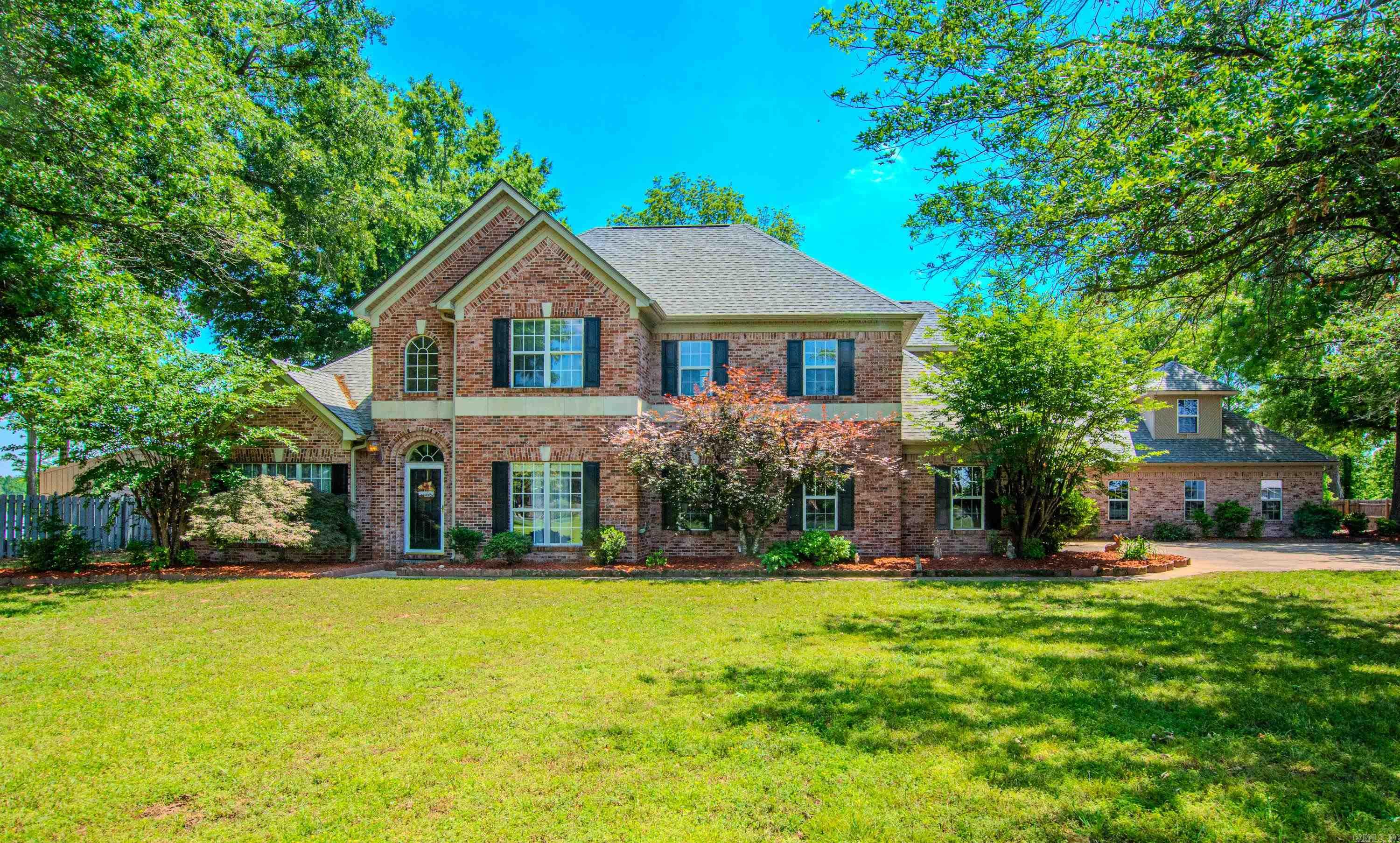 Retreat to this lakefront property that keeps giving.  It has over 2 acres with 5 Bedrooms, 5 Bathrooms, Formal Living Room, Large Recreational Room loaded with windows, Den, Office Room, Formal Dining, breakfast area and breakfast bar. The kitchen has ice maker, trash compactor, warming drawer, new oven, microwave. It has 3 washer & dryer areas (one up & two down). 2 bedrooms down and 3 upstairs. Has 3 bathrooms on main level and 2 upstairs.  Also has walk up into a rough finished large floored attic for storage. New roof, new carpet upstairs, freshly painted upstairs, 2 new AC units, new privacy fencing. New pool pump/motor, 5 car garages, mainly brick exterior with very little vinyl siding. Has a In-ground pool with new pool pump and motor.   2 new garage doors on the first set. Gazebo and small pier also.  Large enough for several families.  The 2 angel doors do not convey.