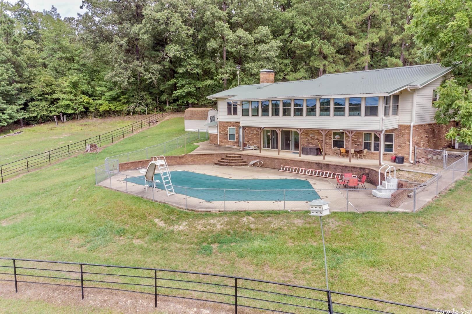 Your own spot of Heaven on Earth.  This property offers, 156.76 acres of pasture land, fencing & cross fencing, pole barn, Pipe fenced cattle corral, 2 ponds and year around creek, see Virtual tour.  House offers SO much, updated kitchen with large island & all appliances convey, 2 fireplaces one has large insert.  Downstairs offers large living space, 2 bedrooms and large bath with jetted tub and walk-in shower plus walkout doors to an amazing inground pool.  See assoc documents for additional amenities.
