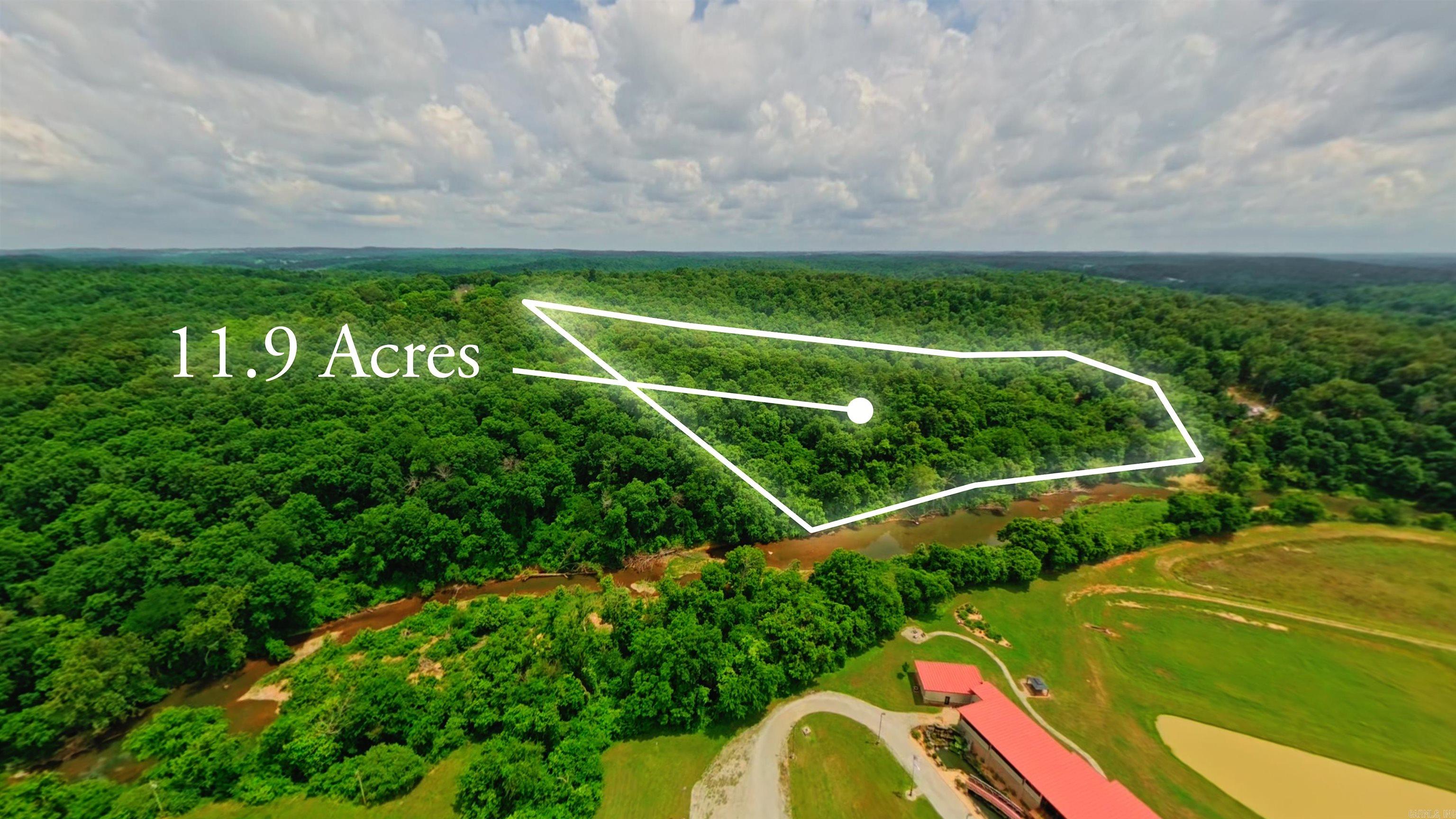 Located just outside Mammoth Spring, Arkansas, this 11.9-acre wooded tract offers over 500 feet of Warm Fork River frontage and excellent privacy at the end of a dead-end road. The property is directly across the river from the Mammoth Spring Fish Hatchery and features mature timber, abundant wildlife, and a beautiful natural setting.  A good build site sits atop the hill, making this an ideal location for a cabin, home, or weekend retreat. With no restrictions, you have the freedom to build, camp, park an RV, or hold the property as an investment. Enjoy fishing, kayaking, hunting, and outdoor recreation right from your own land. Riverfront properties with this much frontage, privacy, and flexibility are becoming increasingly hard to find. Don't miss this opportunity to own a piece of the Ozarks.