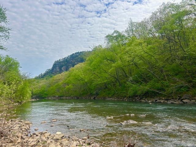 4.41 acres of beautiful RIVERFRONT property on THE LITTLE RED RIVER, offering both county road frontage and direct water frontage. This unique parcel is ready for your vision, with existing utilities already in place-including power and fiber internet-saving you time and expense. The property previously had an old house on it and features a shop building with a concrete floor,, perfect for storage, hobbies, or future projects. In a private setting , it provides the ideal backdrop for building your dream home, weekend retreat, or investment property.  Property like this doesn't come along everyday for a price like this. Don't miss your opportunity to see it for yourself.
