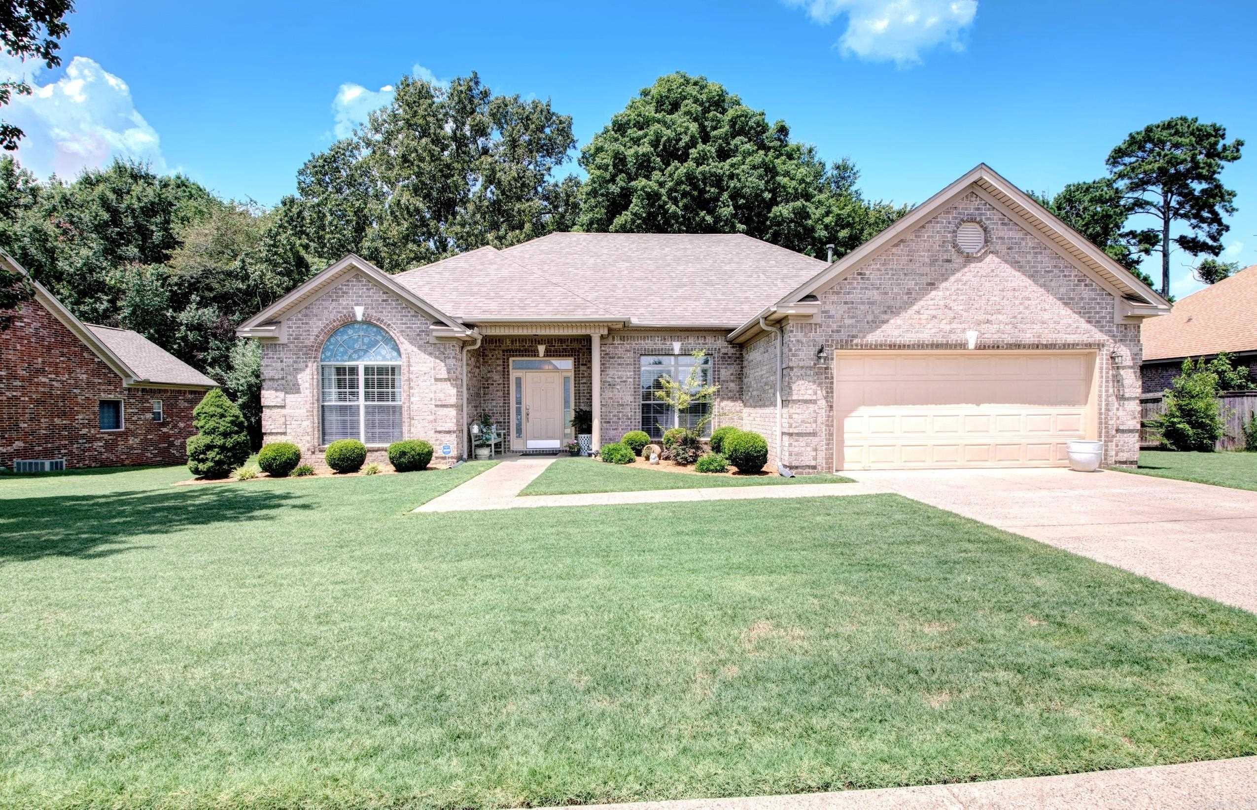 Move-in ready and beautifully maintained! This all-brick home features an open-concept living space flooded with natural light, perfect for both daily living and entertaining. You will love the freshly updated flooring throughout the living areas and bedrooms. Designed with a desirable split floor plan, the layout offers maximum privacy for the primary suite.Step outside to the back patio, which overlooks a peaceful, wooded area where you can regularly enjoy local wildlife and natural beauty. For ultimate peace of mind, a secure safe room is conveniently located in the garage. Situated in a prime, central location, this home offers quick access to the interstate, local dining, and shopping.