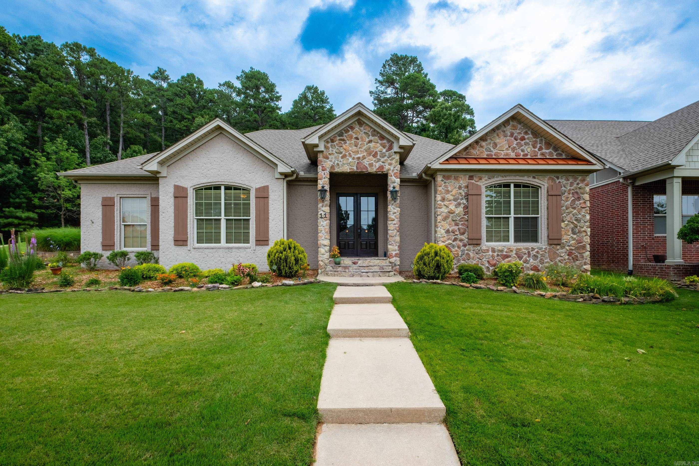This thoughtfully designed, handicap-accessible home that blends comfort,functionality,and custom craftsmanship.Built in 2008, this beautifully maintained 2-bed,2.5-bath home offers an open-concept layout ideal for both everyday living and entertaining.Step inside to discover living areas enhanced by custom cabinetry throughout.Several well-placed sky tubes and large windows fill the home with lots natural light, creating a bright and uplifting atmosphere. The open living and dining areas flow seamlessly, perfect for gathering with family and friends. A private office offers a quiet retreat for remote work, hobbies, or study, while a heated and cooled flex room previously used as a workout space adds even more versatility.The owner suite is designed with comfort and accessibility in mind,featuring direct access to the patio and bath with a Lg walk-in shower and an expansive walk-in closet.The secondary bedroom includes its own en suite bathroom complete with a jetted tub ideal for guest privacy and comfort.A convenient half bath is thoughtfully placed for guests.The garage is a woodworker’s or gardener’s dream.The back screened in patio has tons of space for outdoor entertaining