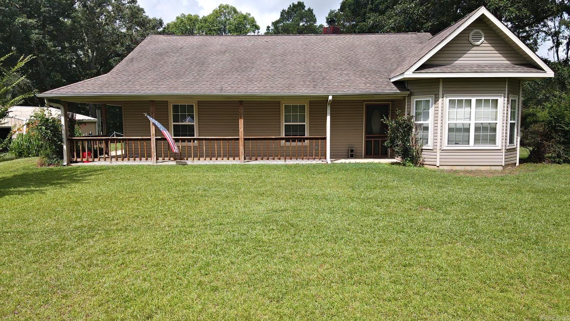 This beautiful 3-bedroom, 2-bathroom home, located just minutes from Lake DeGray, offers the perfect blend of peaceful country living and modern convenience.  Inside, you will find hardwood floors, spacious bathrooms and bedrooms, a cozy wood-burning stove setting on a brick fireplace and a nice laundry room.  The cozy enclosed back porch has entrances into the dining room and the laundry room! All the kitchen appliances convey with the home. Outside, the property features an additional 12 X 24 cabin that could easily be converted into a guest quarters or extra living space, two detach metal shop/garage buildings offering plenty of storage and workspace.  (One is 24 X 30 and the other is 30 X 30.) Situated on 3.66 beautifully acres, this property provides both comfort and versatility for ones forever home or the summer lake home. Roof replaced in Dec 2016, Water Heater is 3 years old, HVAC Heat Pump Jan 2019. Well built home. Must check out the attic space!! Seller will pay $10K toward buyer's closing cost with full price offer Call today for a showing!