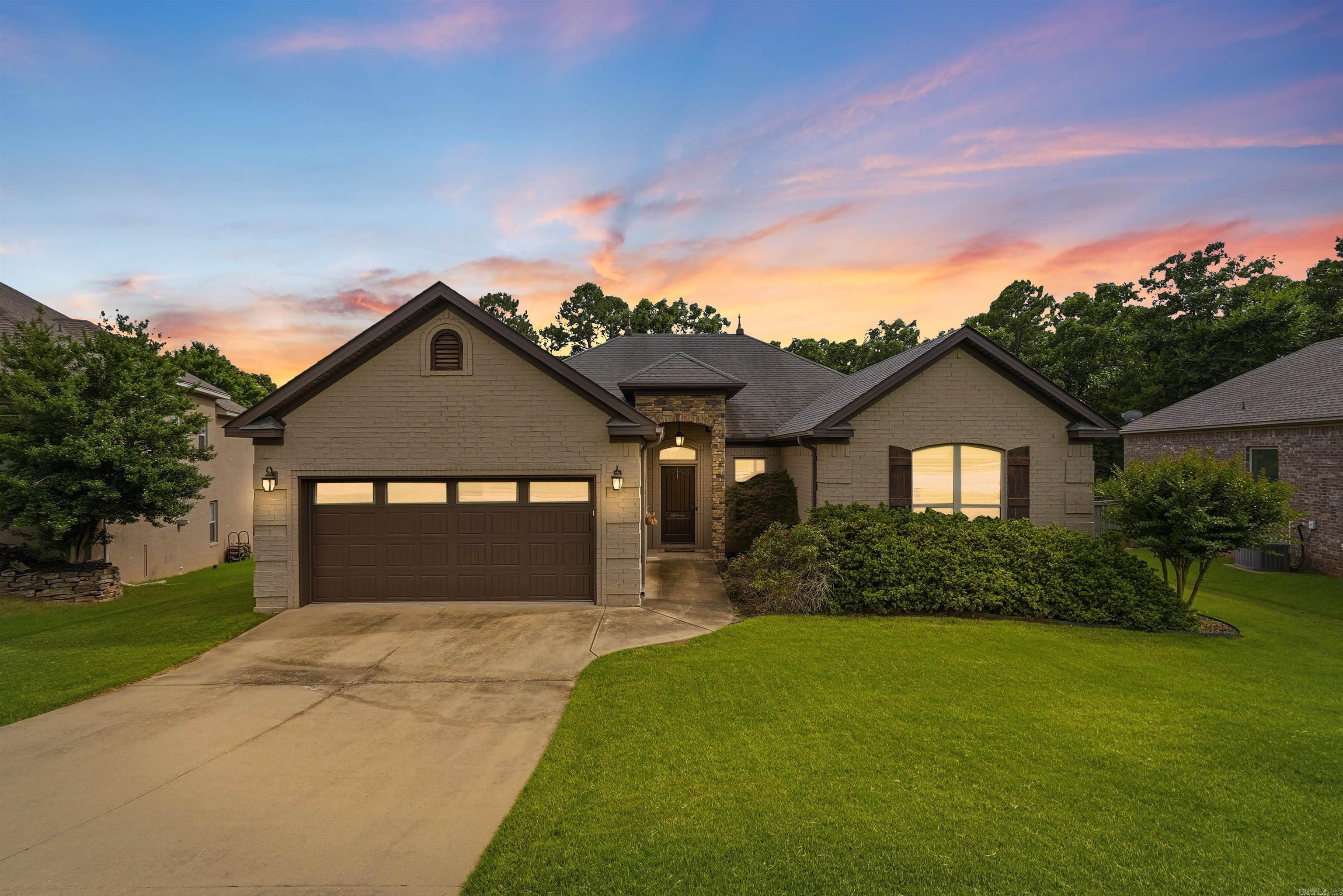 Welcome to 12 Cedar Cove in Maumelle! This well-maintained home offers an open-concept floor plan designed for comfortable everyday living and easy entertaining. The spacious living area features a gas fireplace and flows seamlessly into the kitchen, complete with a gas range and ample workspace.  Step outside to enjoy the private covered patio, perfect for relaxing or hosting guests year-round. The fully fenced backyard provides a versatile outdoor space, while the sprinkler system helps keep the lawn looking its best.  Conveniently located near neighborhood amenities, this home is just moments from a community pool, tennis courts, and scenic Lake Willastein, offering easy access to recreation and outdoor enjoyment. Combining functional living spaces, desirable features, and a sought-after Maumelle location, this property is ready for its next owner. Schedule your showing today!