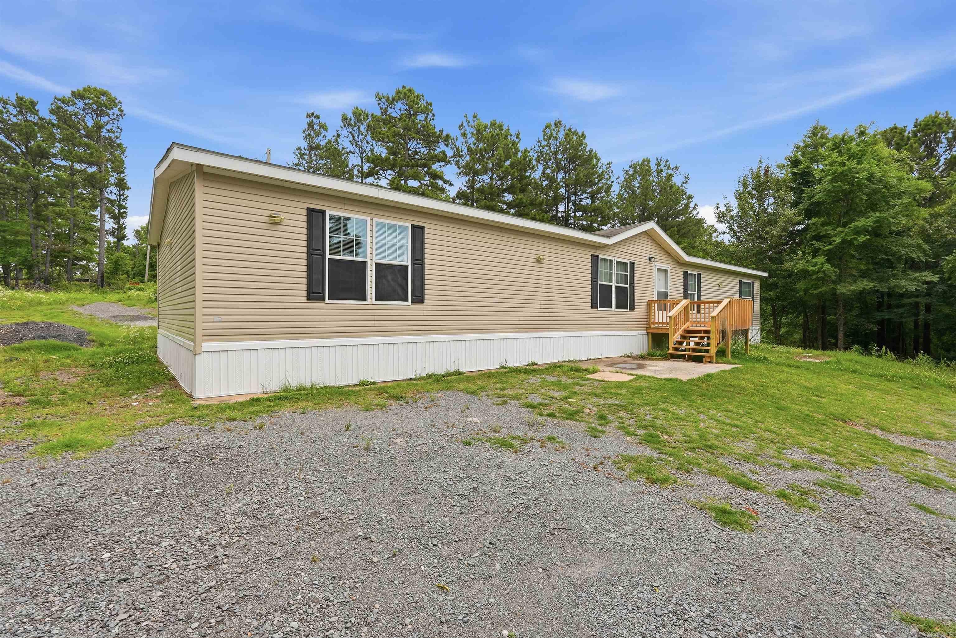 NEWLY REMODELED Spacious 4-bedroom, 2-bath manufactured home offering approximately 2,100 sq ft of comfortable living space, situated on 0.99 acres at the end of a quiet road for added privacy. This property provides a peaceful country setting while still being conveniently located near local amenities. Inside, you’ll find a well-designed layout featuring a large den with a cozy fireplace—perfect for relaxing or entertaining. The generous square footage allows for multiple living areas, spacious bedrooms, and flexibility for a growing household or those needing extra space. The one-acre lot offers plenty of room for outdoor activities, gardening, or future improvements. With its private location and roomy interior, this property presents a great opportunity for buyers seeking space, comfort, and a quiet setting.