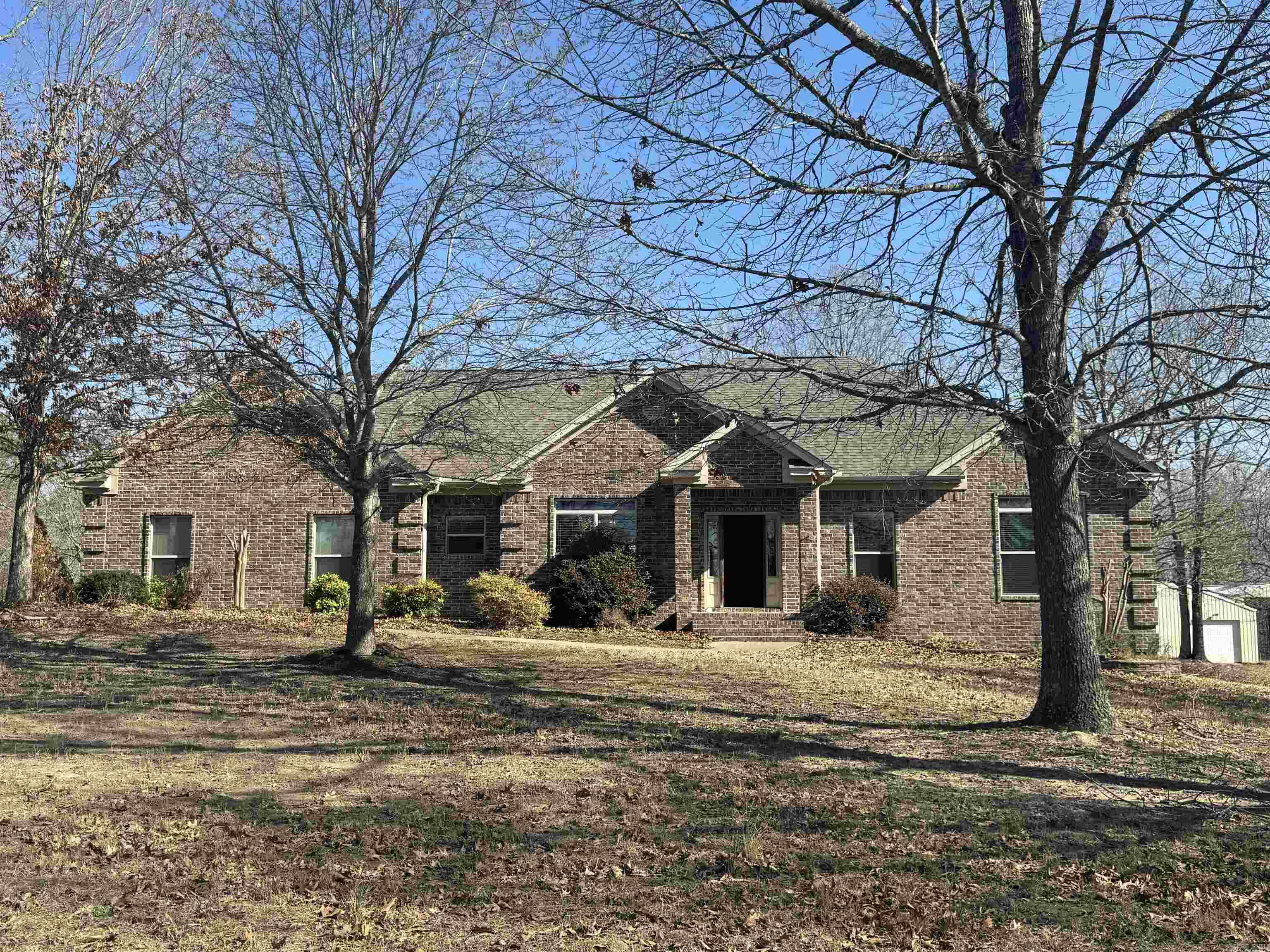 Beautiful 3BR/2.5BA home with split bedroom floor plan situated on 3 acres with a small pond on a quiet dead end road.  Spacious living room features a wood burning stove for cozy evenings.  The primary suite offers his and hers closets, a large soaking tub and a separate shower with dual shower heads.  Recent updates include new wooden cabinets, fresh paint and new flooring in common areas and the primary bedroom.  Granite countertops throughout. Step outside to relax under the private pergola with hot tub just off the back deck, perfect for unwinding and enjoying the peaceful surroundings and wildlife.  Property also includes a 30x50 insulated shop with RV cover, offering ample space for storage, hobbies or equipment. New roof and HVAC in 2022. Peaceful country living with room to spread out!  Agents, see remarks.