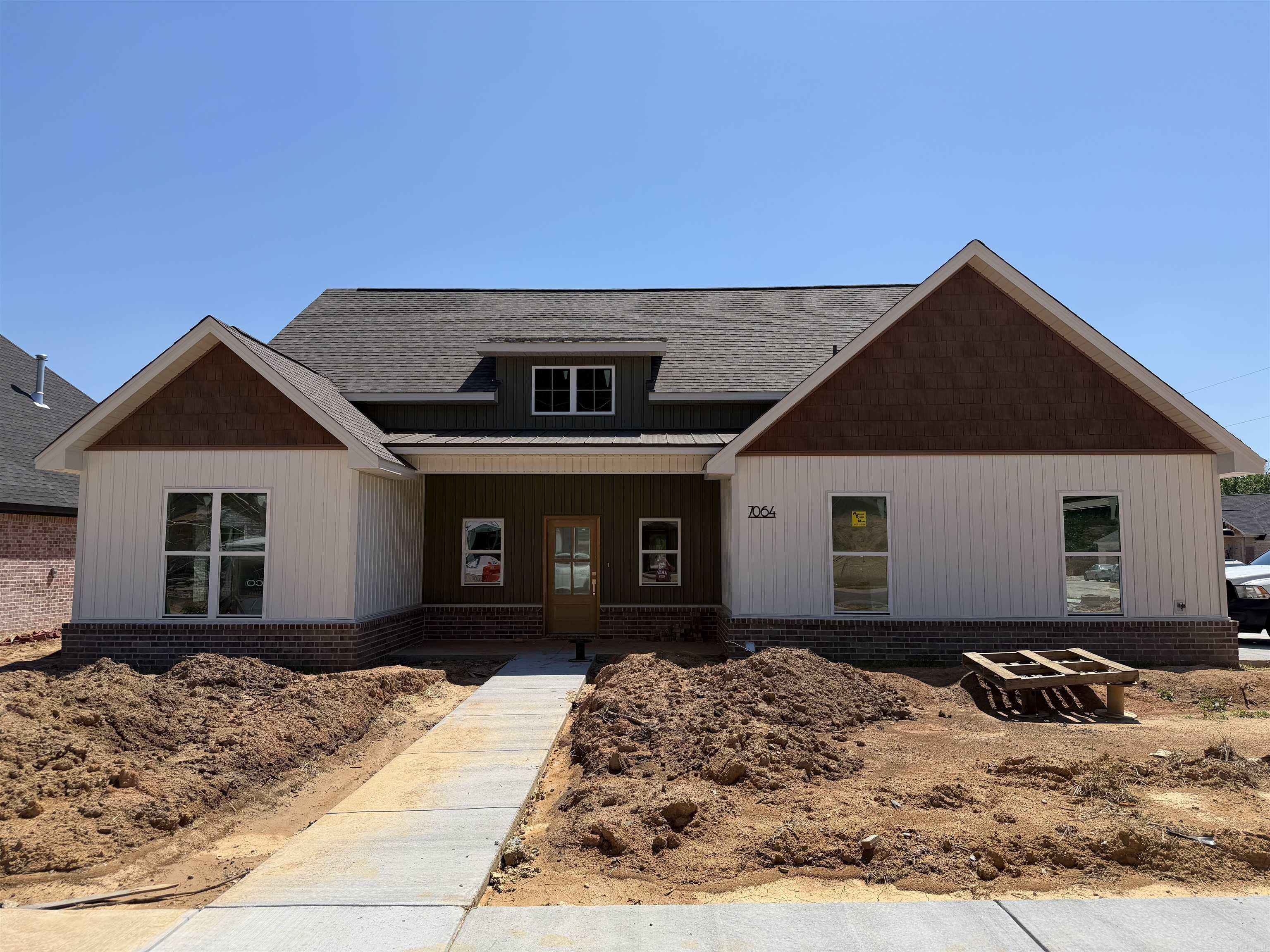 This new construction home on a corner lot in Creekside offers the perfect blend of traditional charm and modern style. Thoughtful details like accent walls, custom trim, vaulted ceilings, and high-end finishes create a bright, welcoming feel throughout. The open layout centers around a beautiful kitchen with custom cabinetry, stylish countertops, and a gas range, flowing seamlessly into the living room with a cozy gas fireplace. The split floor plan provides privacy, with a conveniently located half bath for guests. Enjoy the covered back patio and side-entry garage.