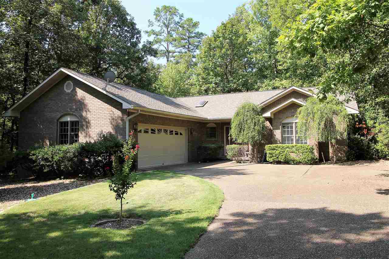 A lovely one story home on a private and level lot. The spacious kitchen was completely updated in 2016 with an amazing amount of storage, breakfast bar, lots of pullouts, and skylight. Open living area with a wood burning fireplace insert with a blower. The master suite is huge with walk-in closet, walk-in shower, double vanity, and jetted tub.  Also a partially fenced yard, screened sun room, roof in 2011, new hot water heater, new air handler, lots of storage in the floored attic, and a home warranty.