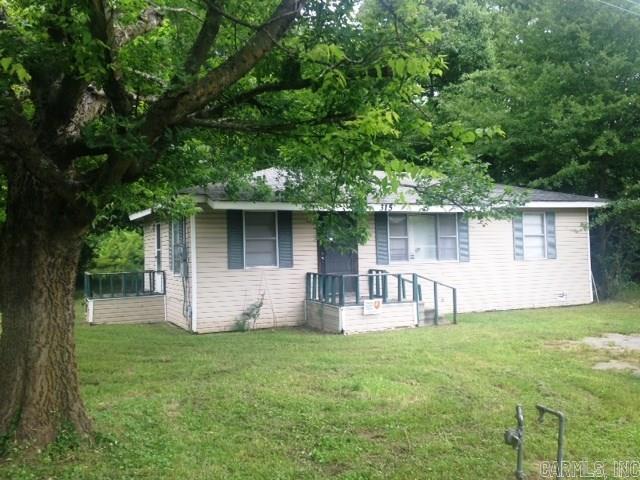This is a cute fixer upper! Low maintenance vinyl siding exterior, nice size lot with storage building that backs up to woods. Home will need electrical wiring, drywall, and a special touch to bring home back to a gem! See agent remarks!