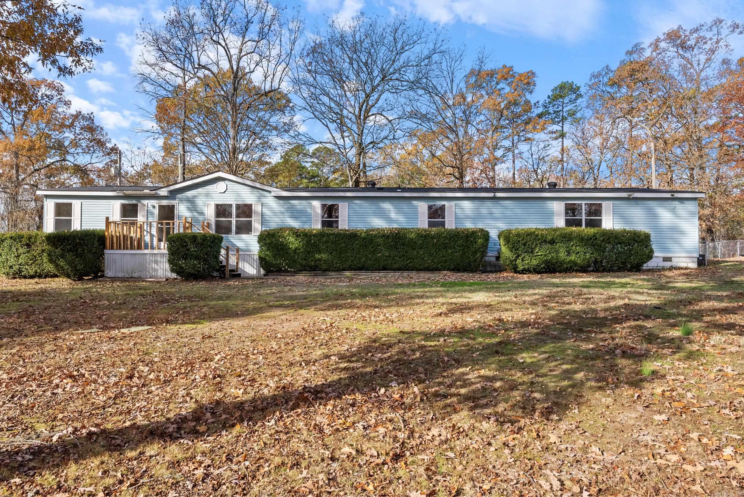 Welcome to this beautifully updated 4-bedroom, 3-bathroom manufactured home, offering the perfect blend of comfort and functionality. Situated on 3 flat, usable acres, this property provides plenty of space for outdoor activities and gardening. Step inside to discover a fresh interior with newly painted walls, updated flooring, and fully renovated bathrooms. The highlights of this home is the separate in-law quarters or second primary suite, providing privacy and convenience for extended family or guests and a whole home generator to help weather any storm. Whether you're looking for extra space for your loved ones or need a home office, this versatile feature is a true asset. You will enjoy the peaceful, rural setting with easy access to local amenities. Don't miss the opportunity to make this charming, move-in-ready home your own! Schedule a showing today and experience the best of country living without being far from all that the city has to offer!