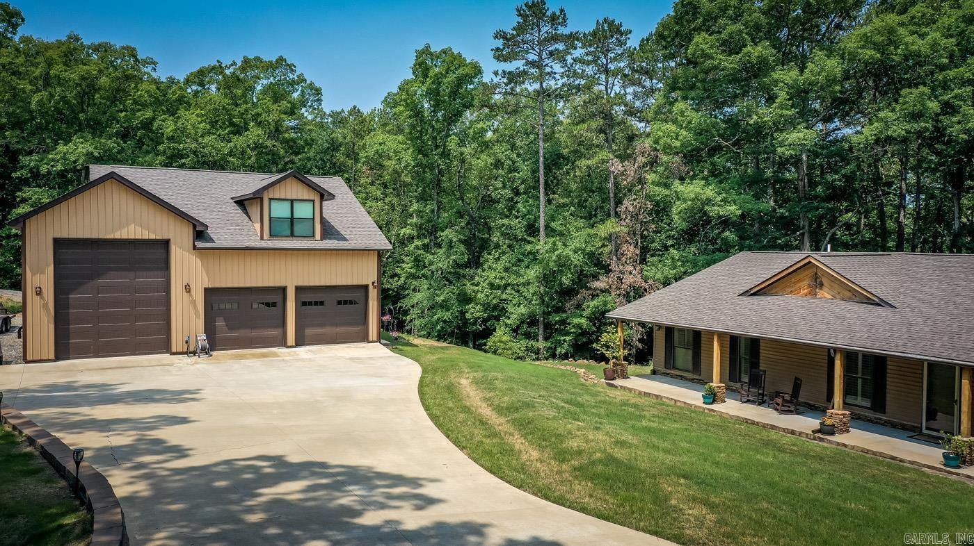 Listed below appraisal!!!!!LAKEFRONT!! Move in ready just bring your swimsuits and hit the lake. This one checks all the boxes. Home completely updated in 2018 and the detached garage was built in 2019. This beautiful 4 bedroom 3 bathroom with 2 primary suites has it all. Sunroom facing that beautiful lake view with covered deck on both sides. Main back deck has a hot tub to relax those tired muscles from playing on the lake too hard. 40x40 3 bay detached garage with 14ft doors on both ends that you can just pull that tower pontoon or RV through. Garage has it's own septic tank, water meter and power pole, separate from the main house. Above the garage is guest quarters w/full bathroom. Easy walk to the water. The list goes on and on. This home is calling you to make tons of memories so don't let this it pass you by. Call today because this beauty will not last long.