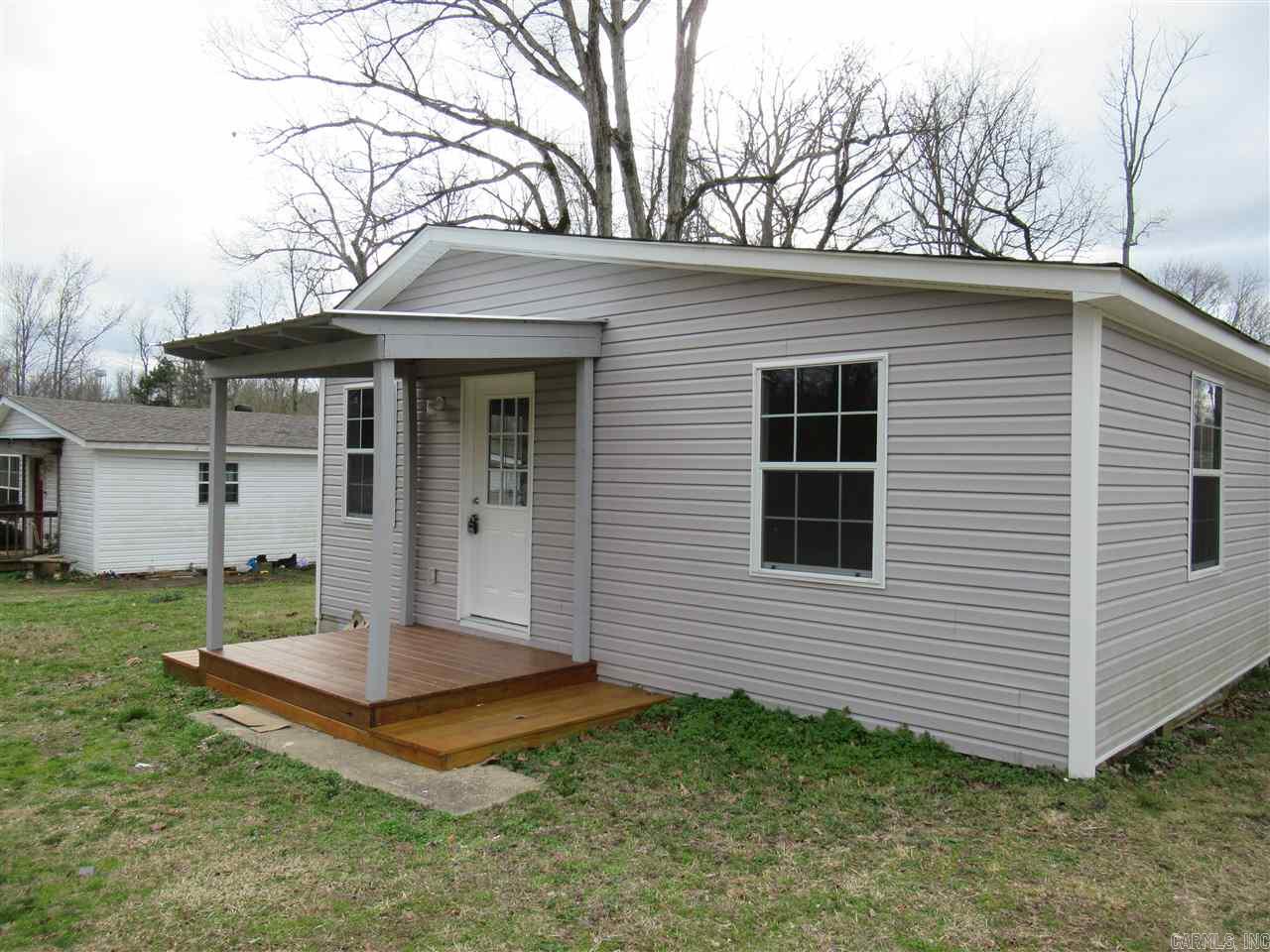 Home has been totally remodeled; Neutral colors; LRM; Kitchen; 2 BDRMS with 2 BTHS;Appliances have been put in for you as well;Large back yard; Deck and Front porch; Country yet close by to town. move in Ready!!!
