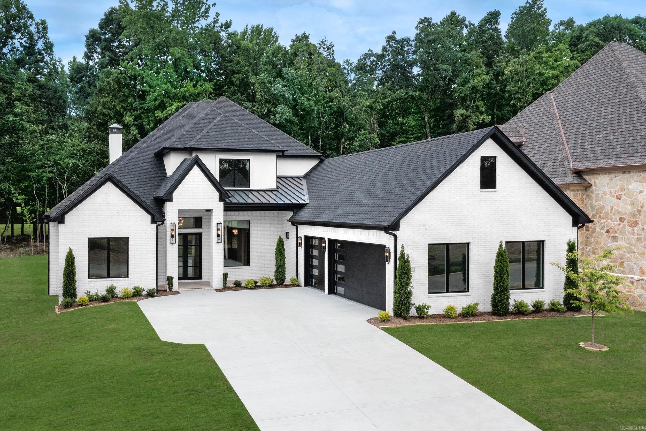 Stunning new construction luxury home in Miramont, Chenal’s newest & final neighborhood offering golf-front lots on Chenal CC Bear Den Course. This exceptional, energy-efficient home truly has everything. Beautiful chef’s kitchen features an oversized island, quartzite counters, ice maker, pot filler, eat-in area, gas range, double ovens, & opens to a butler’s pantry w/ bar sink & wine cooler. An incredible prep kitchen w/ a 2nd dishwasher, sink, extensive cabinetry & space for a 2nd refrigerator. Main level includes formal dining area, luxurious primary suite w/ 2 closets, 2 additional ensuite bedrooms, & office/study w/ a powder bath. Outdoors, enjoy an oversized entertaining space with outdoor kitchen, fireplace, heater, & sweeping golf-course views. Upstairs there is a 2nd laundry room, spacious media/game room w/a wet bar & beverage cooler, plus upper balcony overlooking the course. Additional features include smart-home technology, EV charger outlet, smart sprinkler system, custom epoxy garage floors, complete home network w/ Cat6 Ethernet, & hardwood floors. A rare opportunity to own a home in one of Chenal’s most exclusive gated neighborhoods. Virtually Staged.