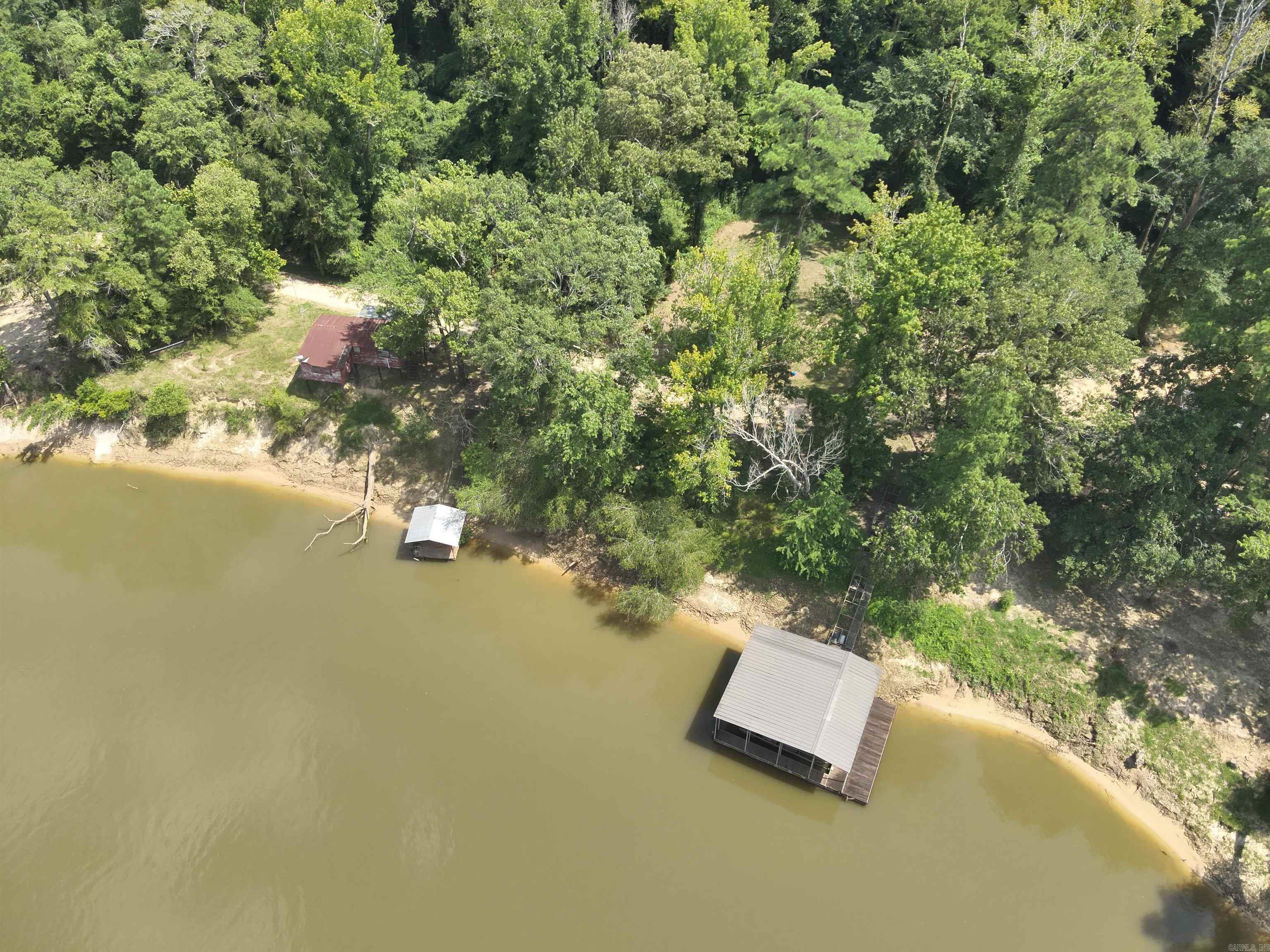 he ‘Careyville Tract’ is a ±189.43-acre tract located in the northeastern part of Union County, AR, about 6 miles from Moro Bay State Park and less than 40 miles from El Dorado. This unique tract is located on the Ouachita River with over ½ mile of river frontage!  Careyville Road, a Union County Road, provides the property providing excellent access.  Typical rural utilities (electrical & water, and county services) are available along the road.  This property is adjacent to Felsenthal National Wildlife Refuge. The tract has numerous woods roads throughout the property for your off-roading enjoyment! The tract has about 37 acres of upland pine, about 25 acres of open water and cypress, and about 124 acres are mature bottomland hardwood. There are also two river lots with a river camp on one lot and two boats docks with stairway access to each!  This property provides a secluded place close to town on the Ouachita River, another location to build a river camp, and a place to hunt and fish, do not miss out on the ‘Careyville Tract’!