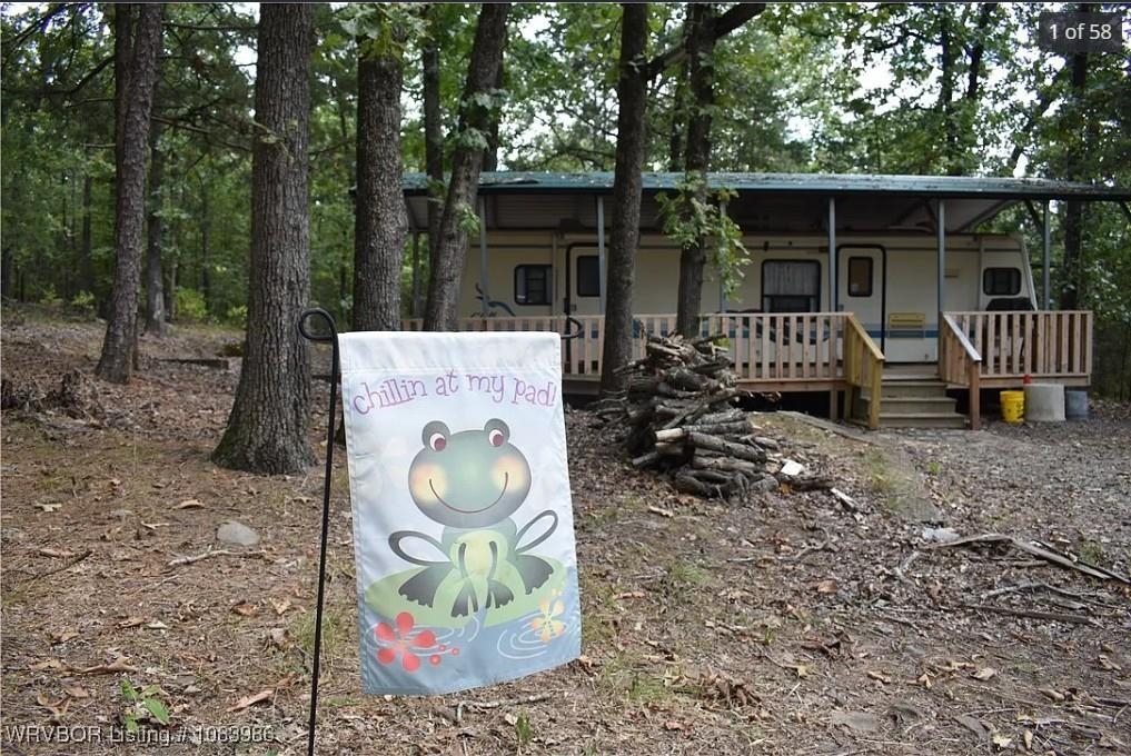 Secluded three acres and travel trailer. 1.2 miles to paved boat ramp at Ashley Creek park and campground and fabulous crappie, bass and catfishing on beautiful Blue Mt. Lake. Also water skiing, swimming and other water sports can be enjoyed. You're also at the doorstep of the Ouachita National Forest, the oldest and largest National Forest in the South, providing unparalleled hunting, hiking, mountain biking horseback riding, ATV riding, rock climbing and many other outdoor activities. Deer blind and feeders are included. The travel trailer is fully furnished and functional. Mattress not include. City water and electricity are on site. Fiber optic is available at the road. Separate hook up for additional travel trailer. The acreage is loaded with large mature pine, oak and other timber. A true outdoor person's opportunity at an affordable price to take advantage of all the wonderful outdoor activities available in this area.