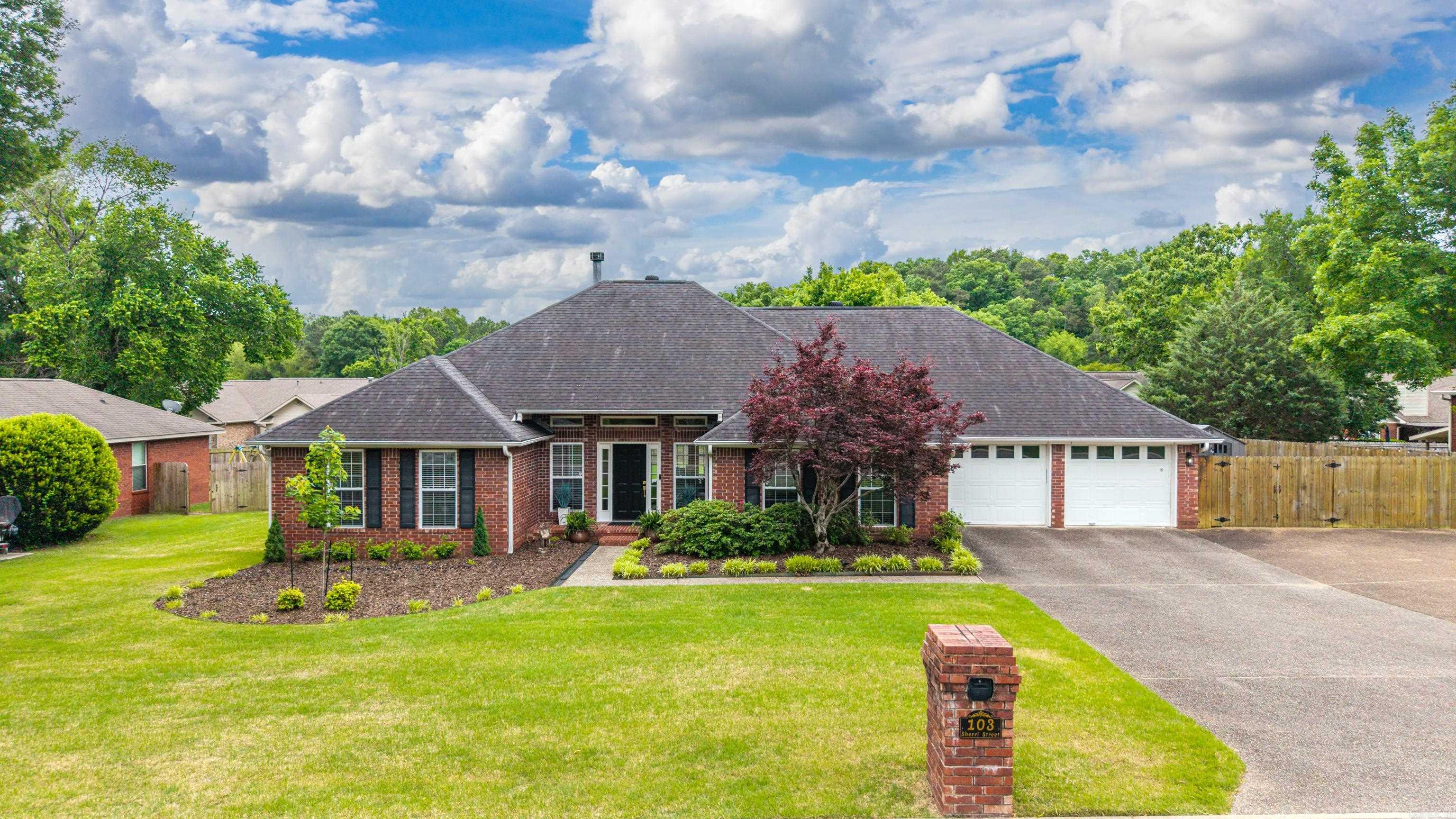 If homes could flirt, this one would already have a line of admirers down the street. Meet your new crush: a ridiculously good-looking, move-in-ready 4-bedroom, 2-bath traditional brick charmer in the coveted Lakeside School District. She’s been impeccably maintained—think “never misses a hair appointment” level of put-together. Inside, you’ve got options (and we love options). There’s a separate dining room for when you’re feeling fancy—or at least pretending to be—and an eat-in kitchen with a cozy breakfast nook for real life: coffee, cereal, and scrolling your phone before fully becoming a person. The kitchen itself shows off granite countertops and sleek steel appliances, ready to handle everything from burnt toast to holiday feasts. The gas log fireplace in the living area brings the cozy vibes without the “who forgot to buy firewood?” stress. Out back, it gets even better. Two bedrooms have direct access to the covered deck—perfect for sneaking out for fresh air, morning coffee, or a little peace and quiet when the house gets lively. The yard is flat, fenced, and ready for pets, kids, or your ambitious-but-optimistic gardening plans. Got a boat? RV? Slightly excessive number