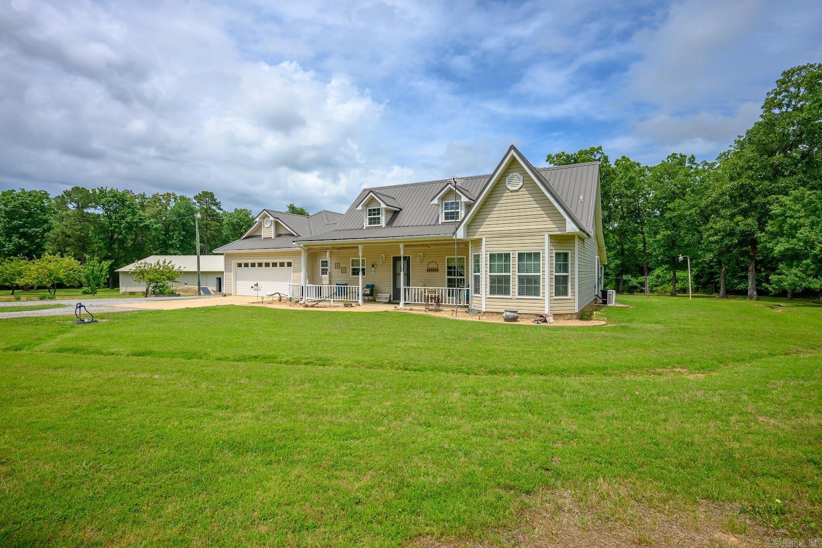 26.29 ACRES M/L, A HEATED INDOOR POOL HOUSE, 40x50 SHOP, STORM SHELTER, AND A BEAUTIFUL COUNTRY HOME—this is the kind of property buyers wait for. Tucked away in the peaceful countryside of Floral, Arkansas, this well-maintained property offers a 3 bed, 2.5 bath home with approx. 2,134 sq ft and an enclosed porch conversion completed within the last 5 years.  Inside you'll find hardwood flooring, quartz countertops, tile backsplash, wood cabinetry, updated vinyl flooring, and a cozy den with cedar-style accent walls.  Step outside and enjoy a stocked pond, garden area, apple and pear trees, and red raspberry bushes. A natural creek winds through the wooded acreage at the back of the property, creating excellent hunting and outdoor opportunities. 6.29 acres m/l are maintained around the home.  The heated and cooled 28x48 indoor pool house features a 14x32 fiberglass pool heated by a Hardy wood stove system for year-round enjoyment. The 40x50 shop offers power, water, a half bath, 220 service, and a 14-ft roll-up door. Also included are a storm shelter, 2-car garage, storage shed, city water, and an additional well not currently in use. Properties like this rarely hit the market.