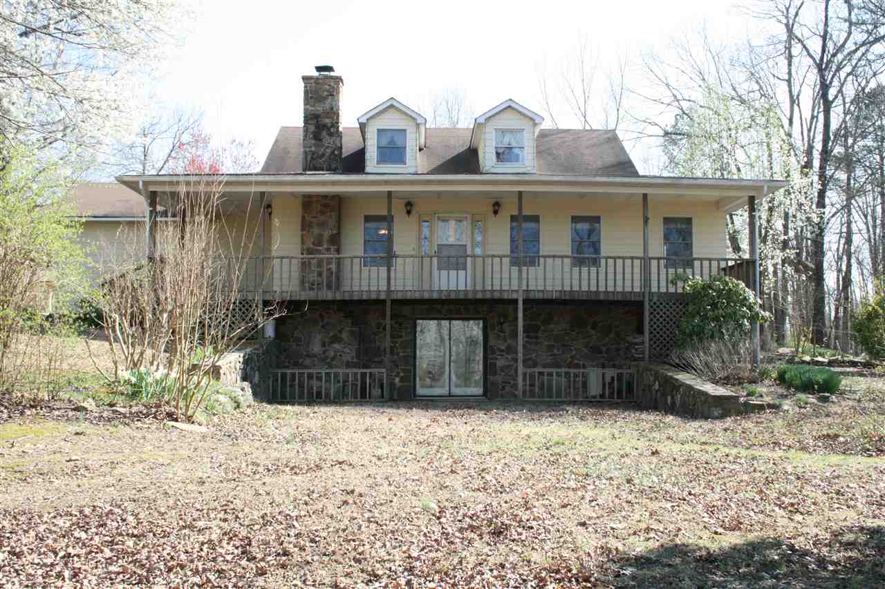 Great Home in the Country with a beautifully landscaped yard. Additional lots in front of house and to side of home insure your privacy. Plenty of storage space in detached shops, additional two car detached garage, plus small Mother -in-law quarters. This one won't last long, priced to sell ! Must see!