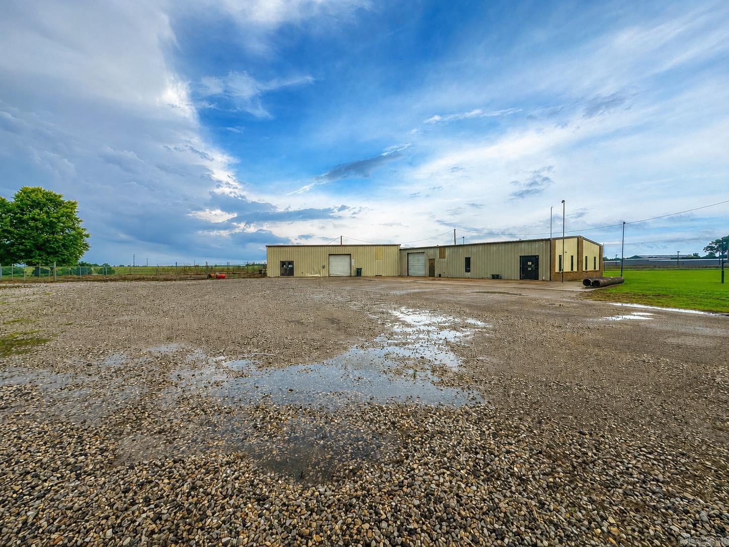 Opportunity awaits with this well-maintained commercial property offering the flexibility to fit a variety of business needs. Featuring two private office spaces, one full bathroom, and central heat and air in a portion of the building, this property is ready for an owner-user or investor looking to expand their operations.    The spacious shop area provides ample room for equipment, inventory, manufacturing, storage, service operations, or a combination of uses. With plenty of outdoor space and easy access for vehicles and equipment, this property is designed to accommodate a wide range of commercial applications.    Whether you're looking for a headquarters for your business, a workshop, warehouse space, contractor yard, automotive operation, agricultural support facility, or investment property, the possibilities are truly endless.